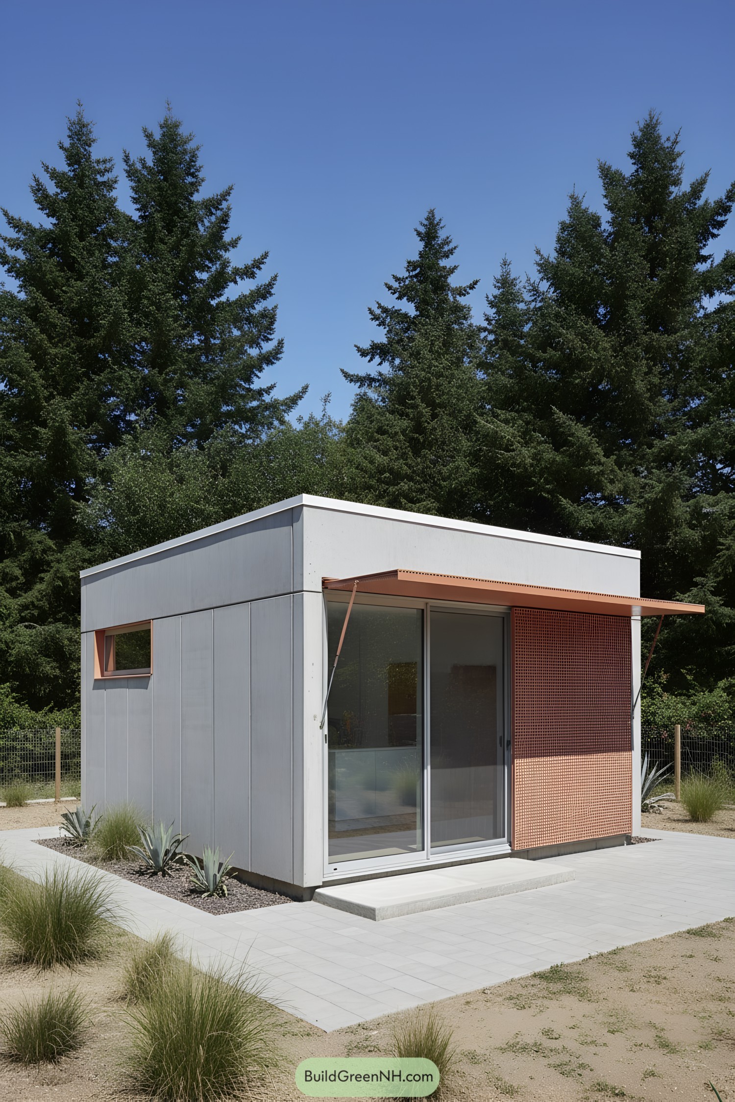 Tiny concrete cabin with sliding glass door, perforated screen, and cantilevered terracotta awning