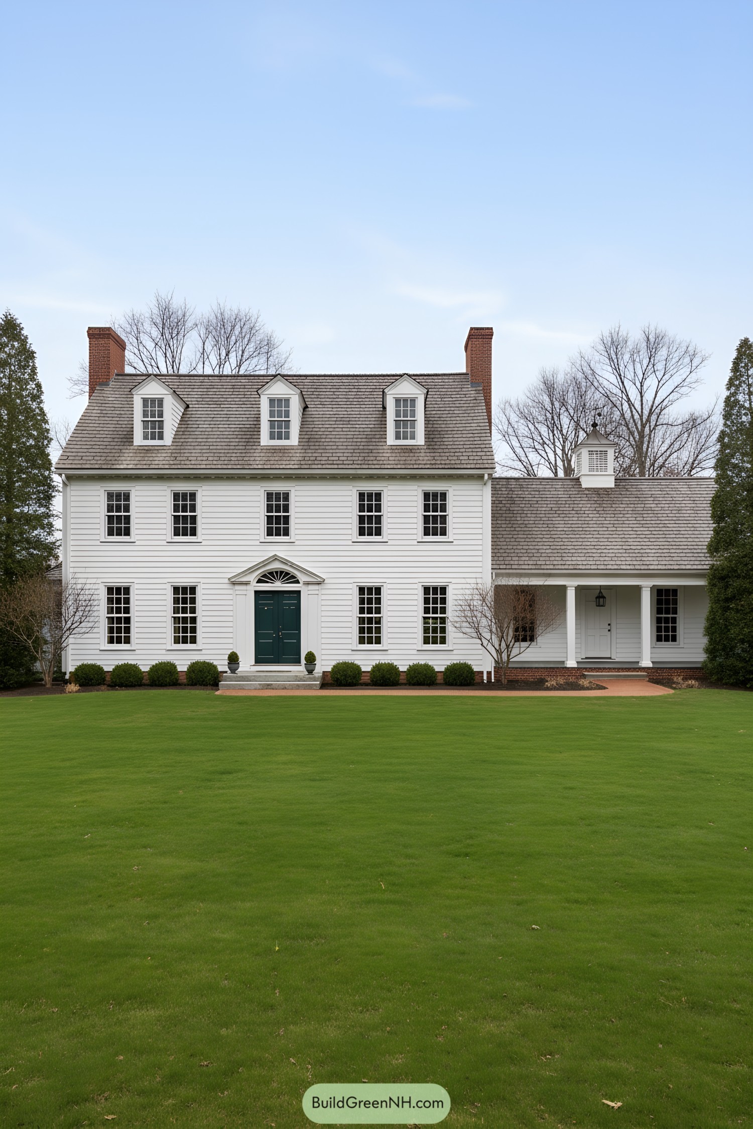 White clapboard colonial with dormers and side porch