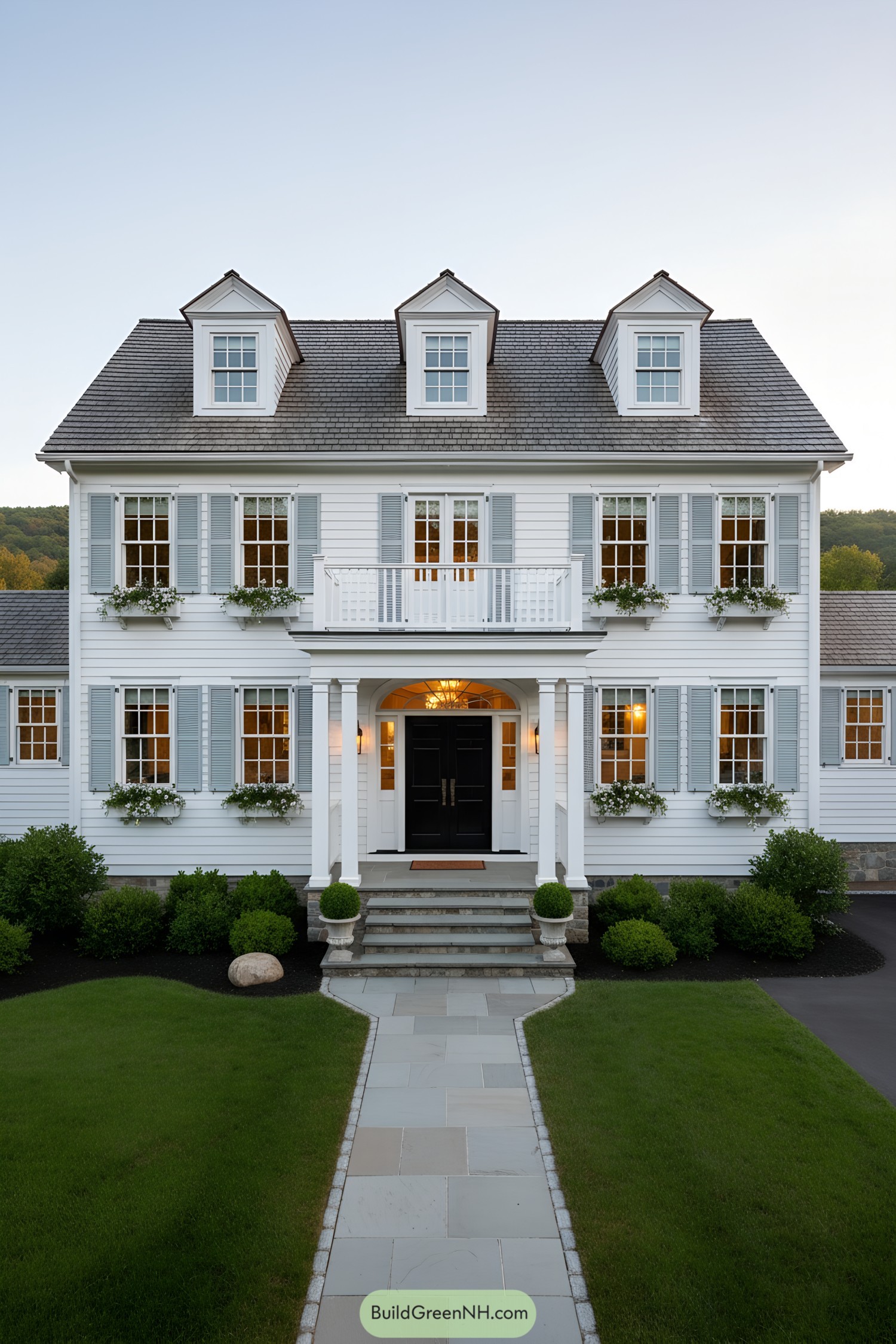 White clapboard colonial with dormers and shutters