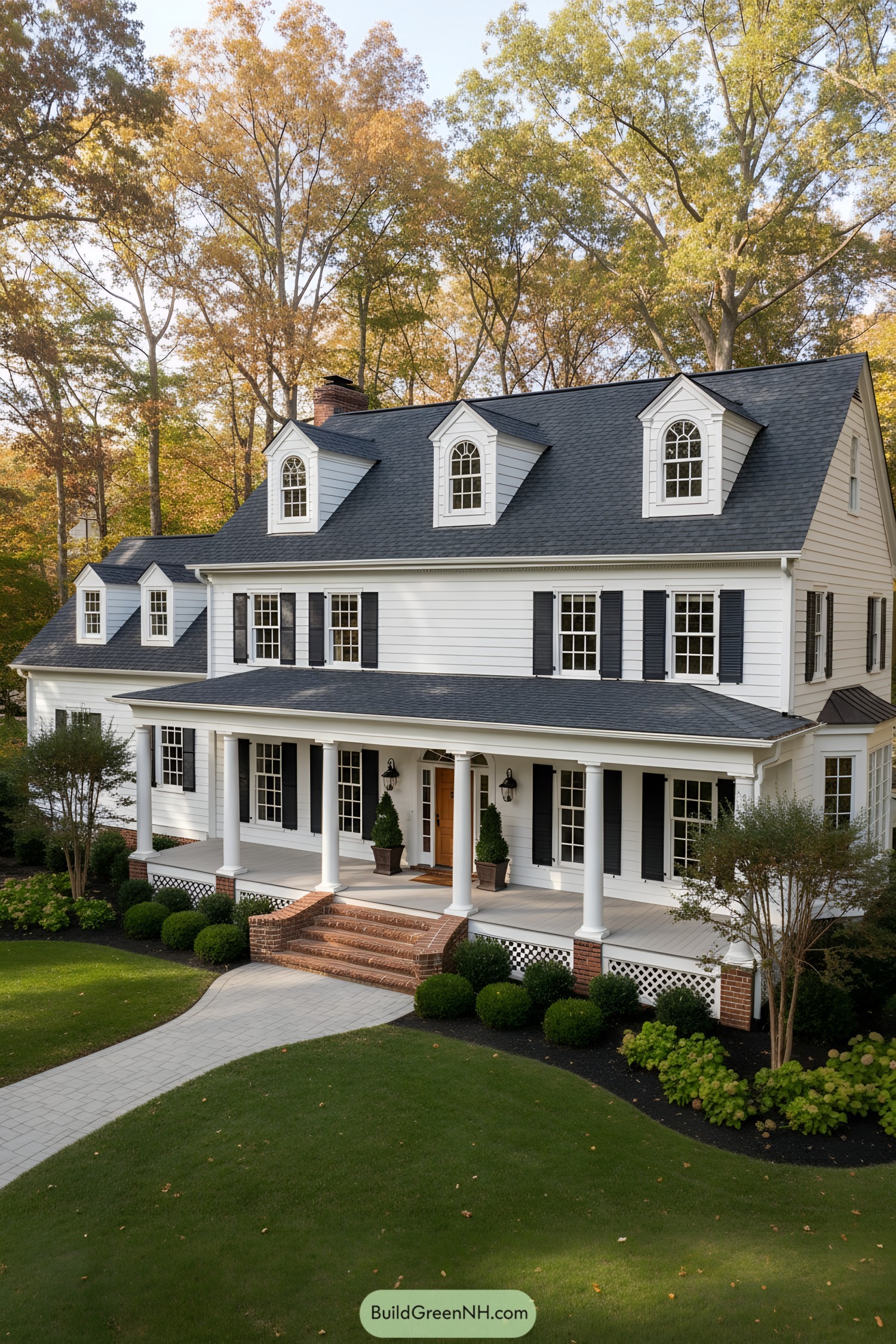 White colonial house with black shutters and dormers
