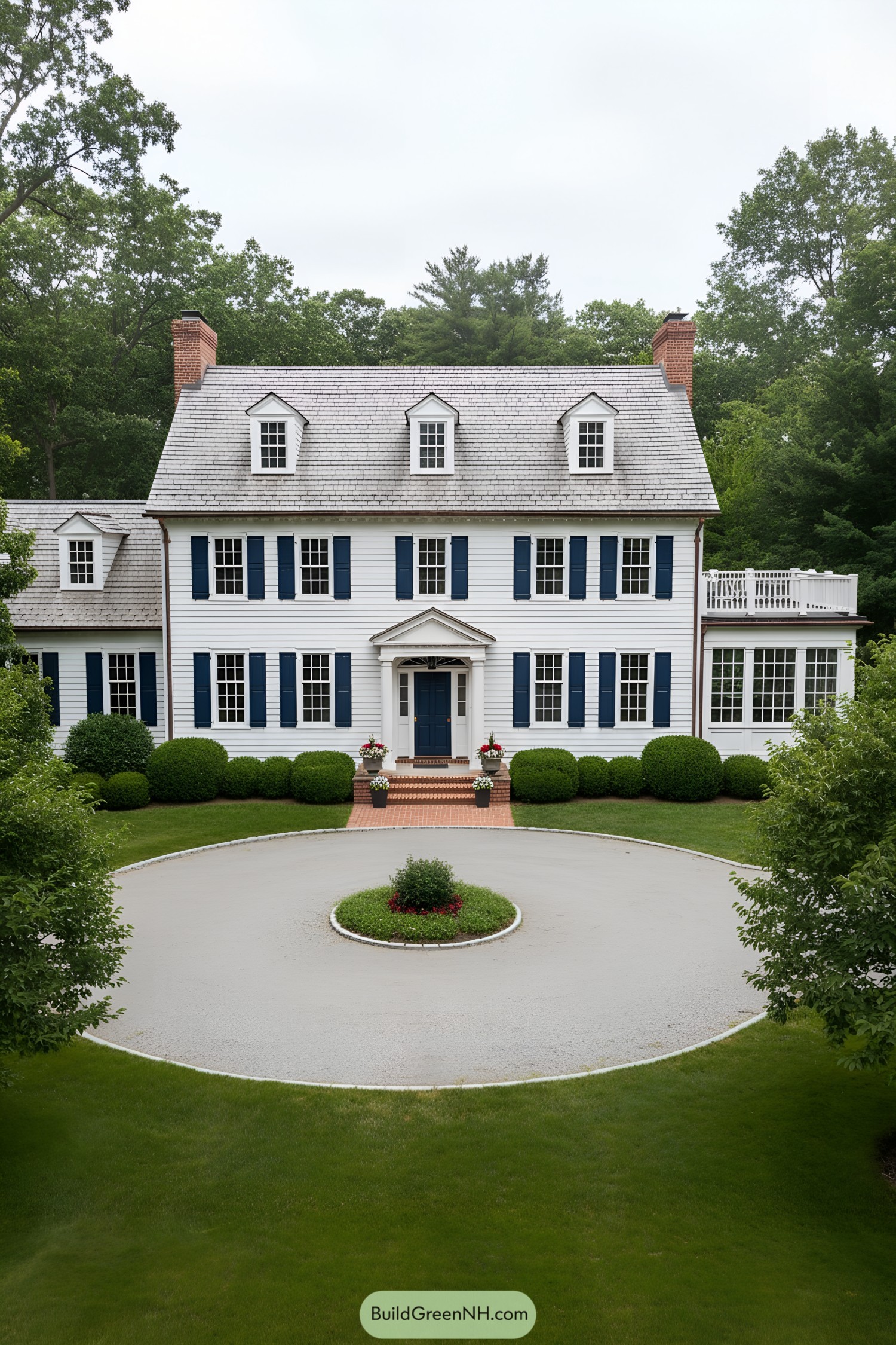 White colonial with blue shutters, dormers, and slate roof