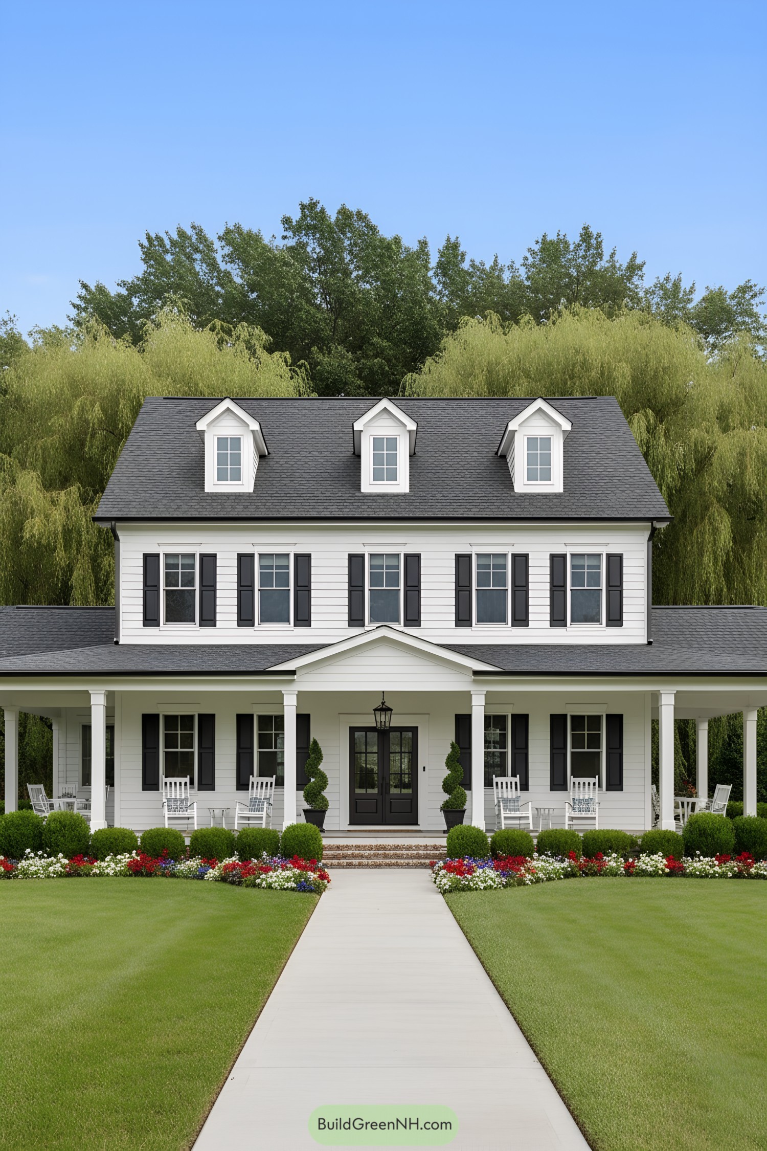 White colonial home with wraparound porch and dormers