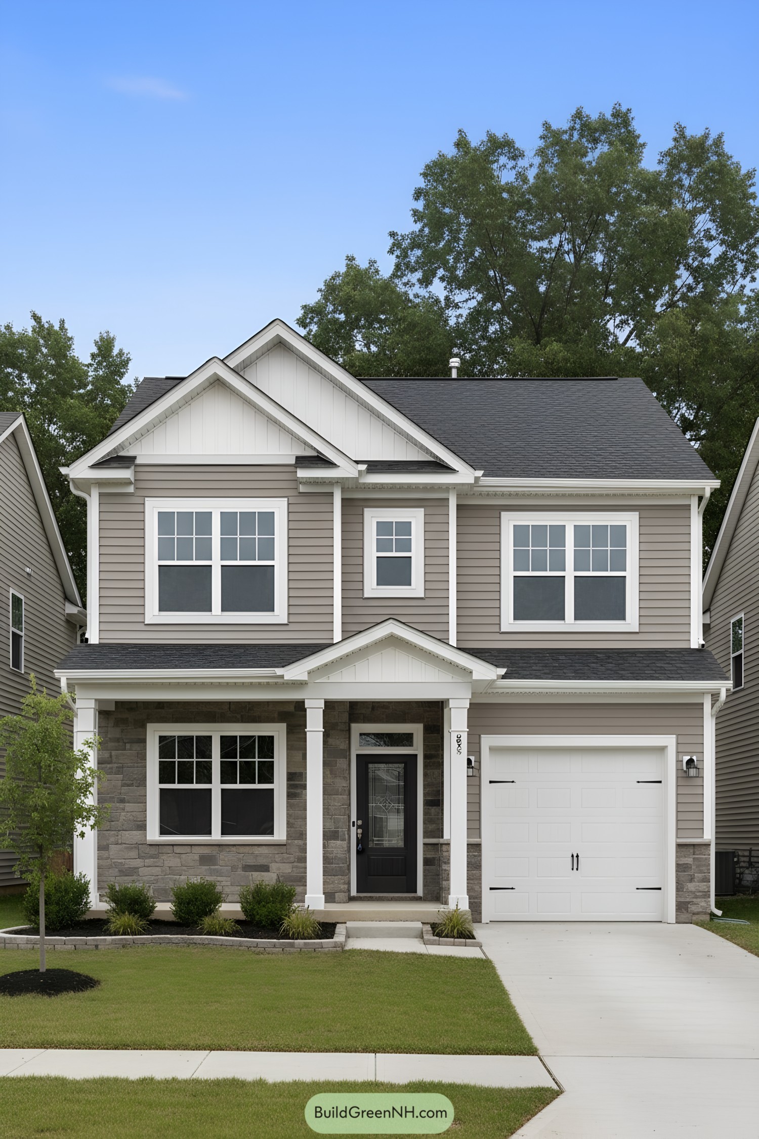 Two-story suburban house with triple gables, stone porch, and single-car garage