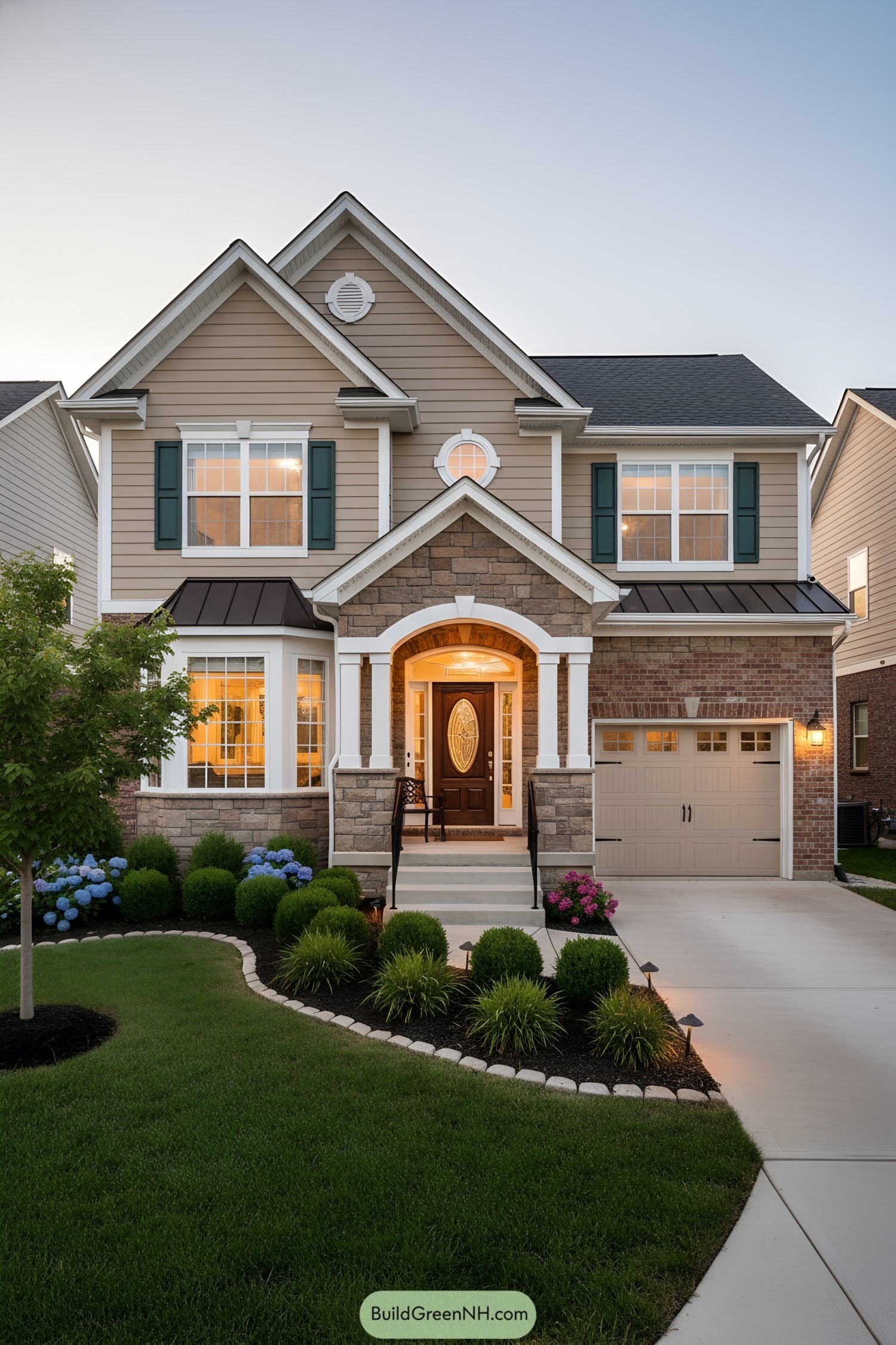 Two-story suburban house with stone entry, bay window, and attached garage at dusk