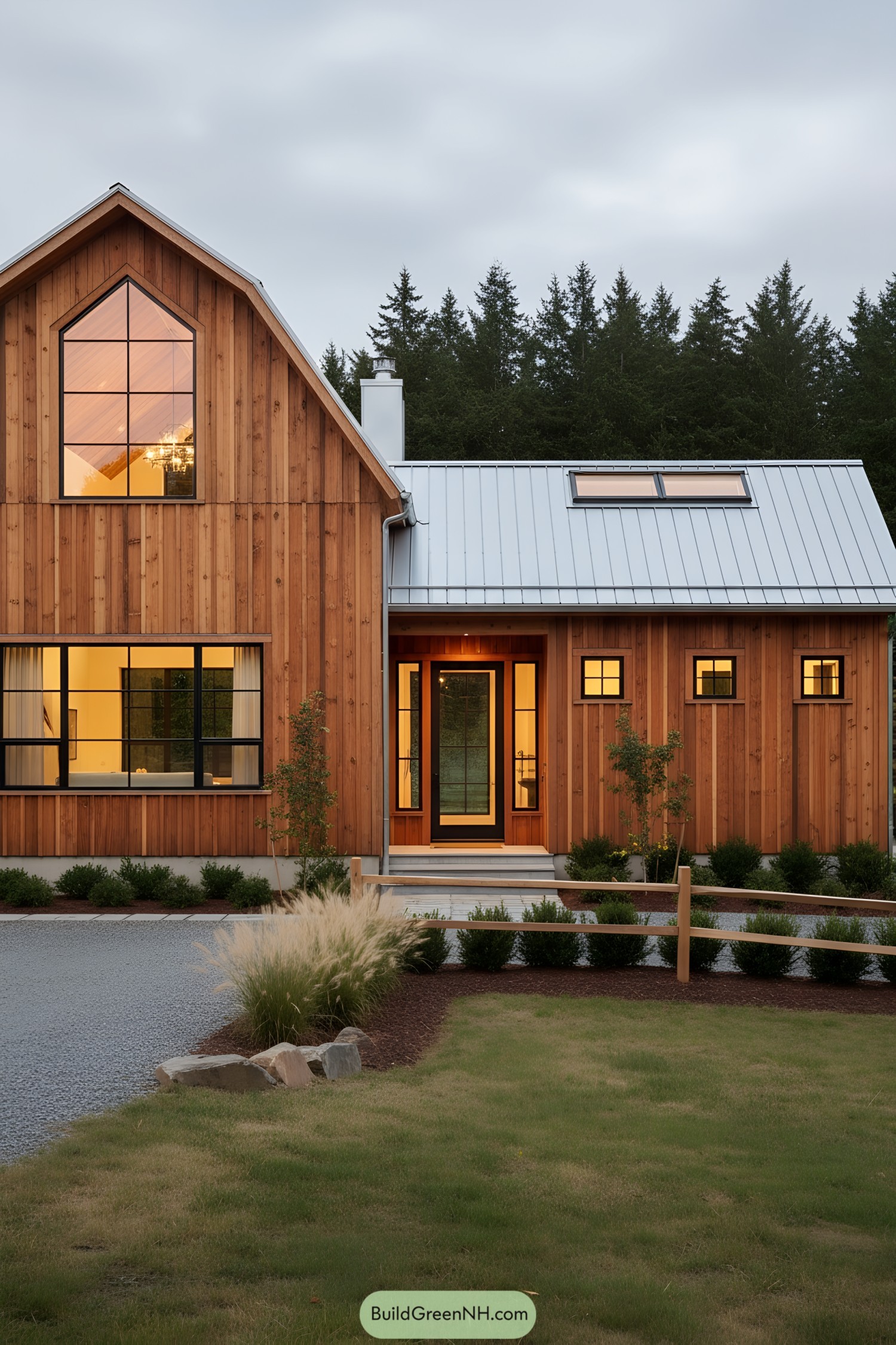 Warm cedar barn home with metal roof and large black-framed windows