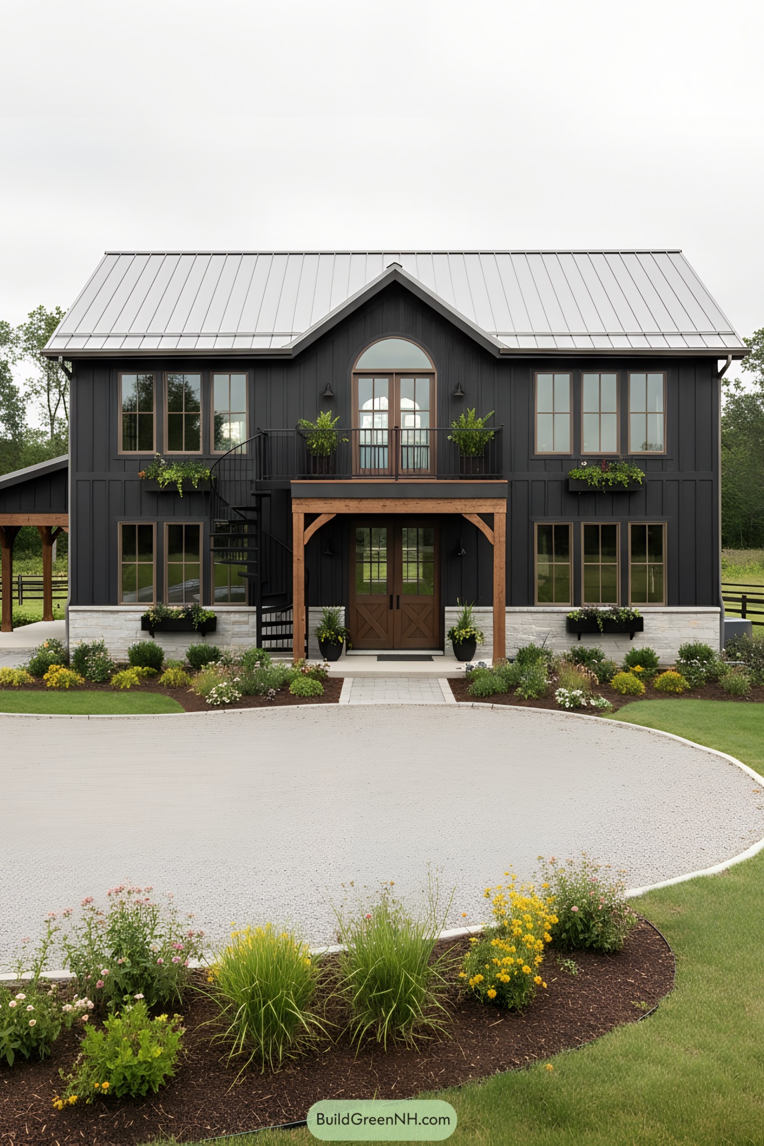 Black two-story barndo with arched balcony and spiral stair framed by timber posts and planter boxes