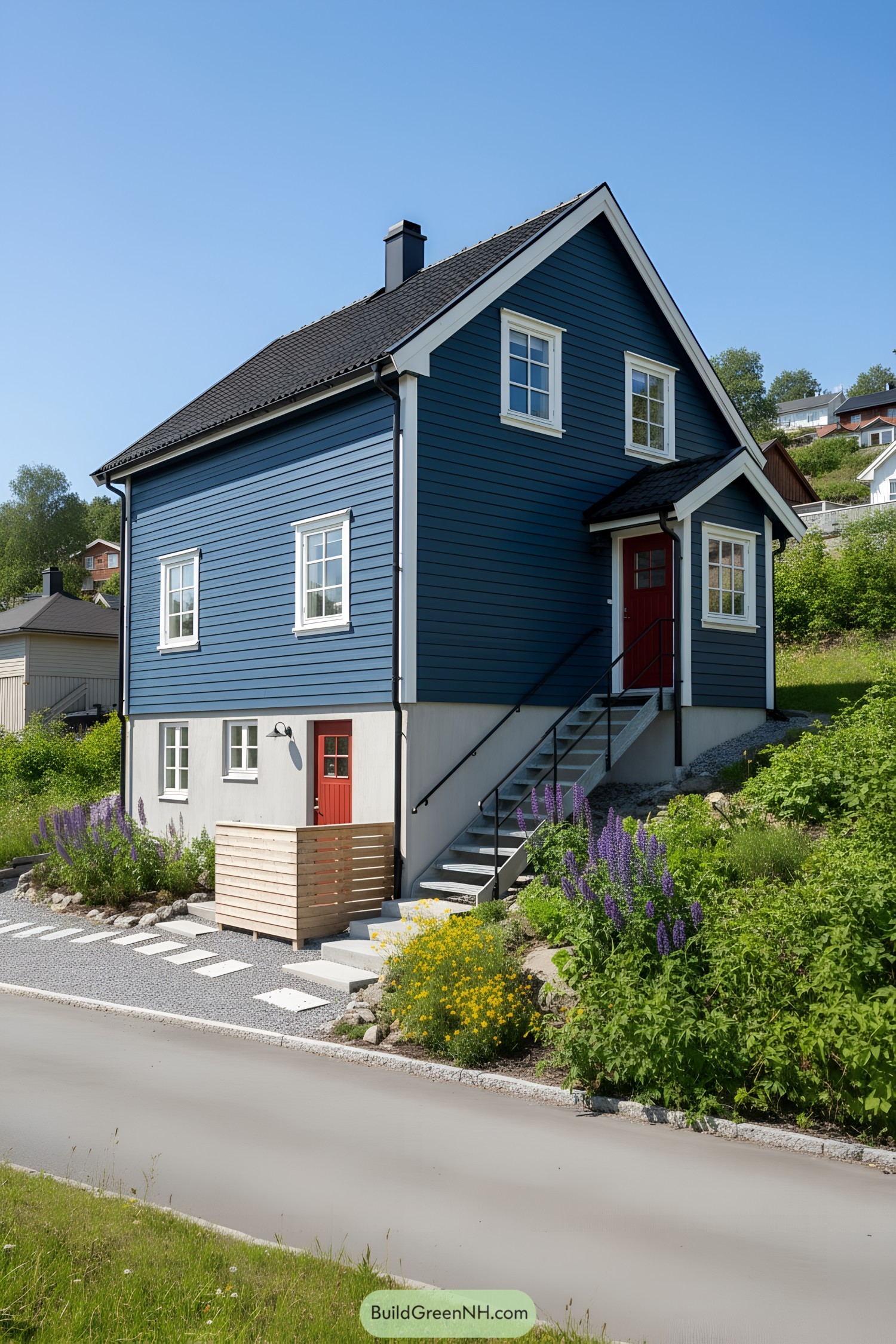 Blue-clad two-story house with red doors