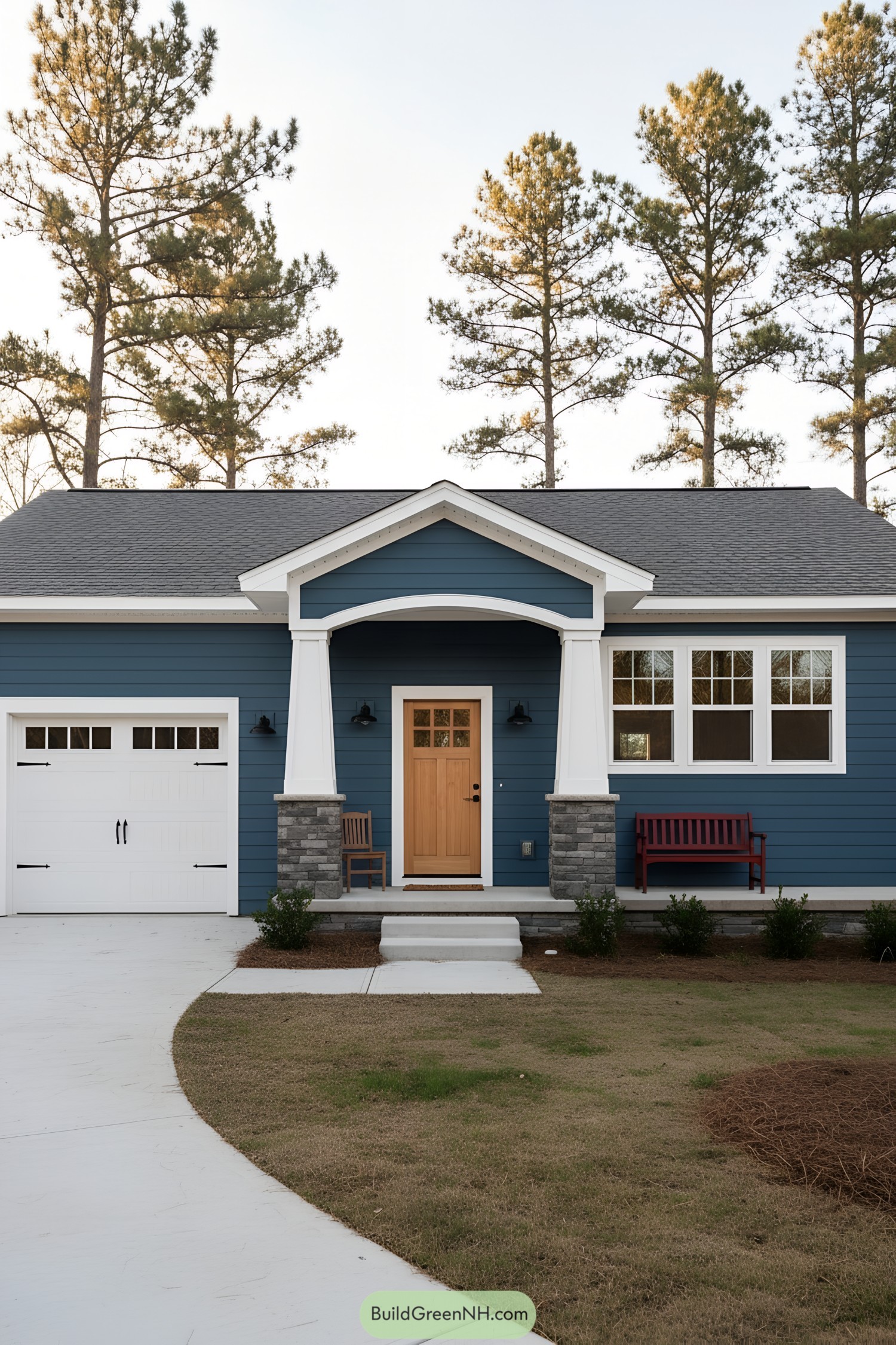 Blue siding ranch with arched portico and natural wood door