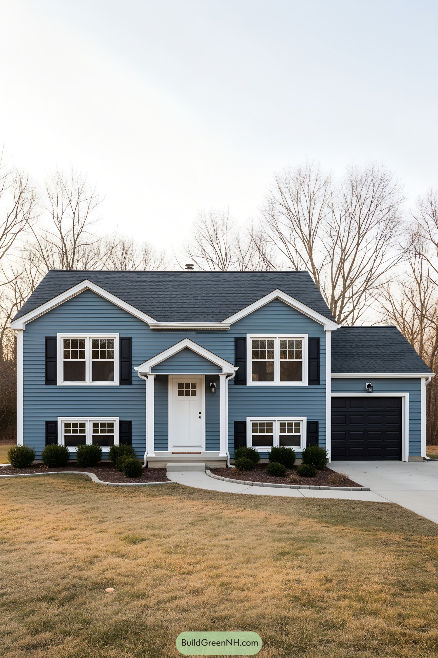 Blue split-level ranch with white trim and black shutters