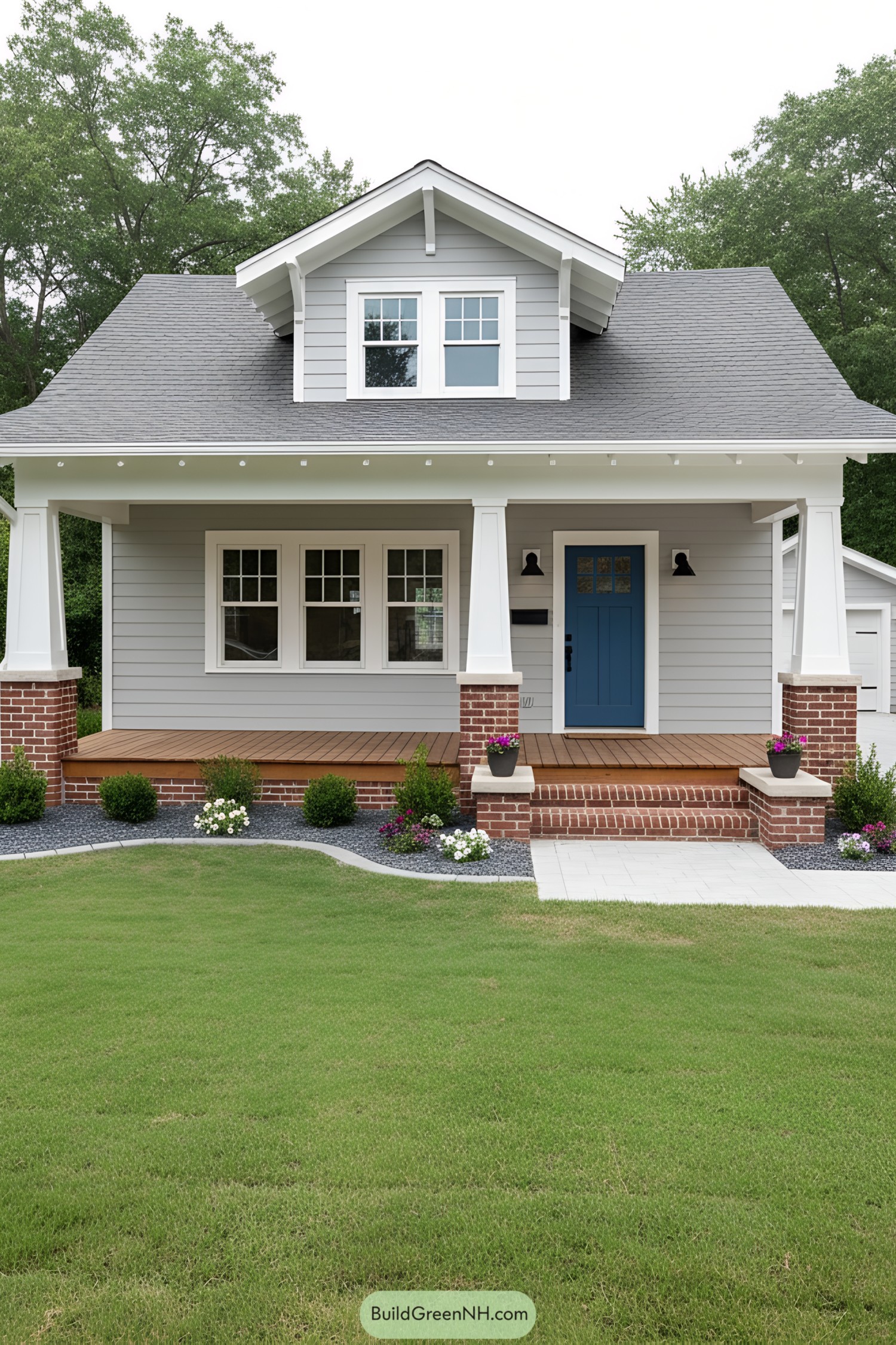 Gray bungalow with broad porch and blue door