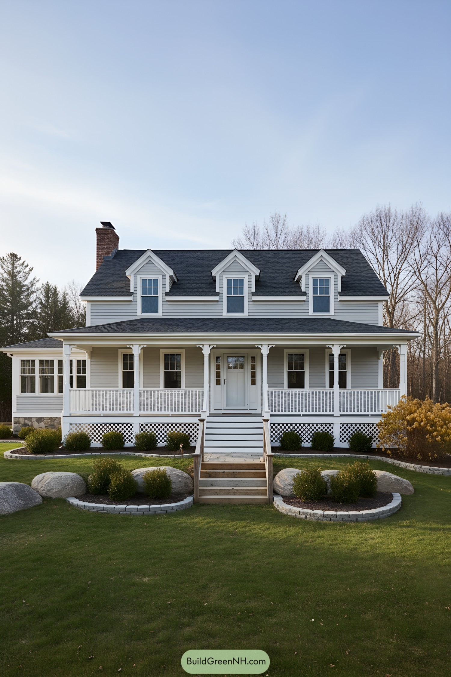 White farmhouse with wraparound porch and dormers