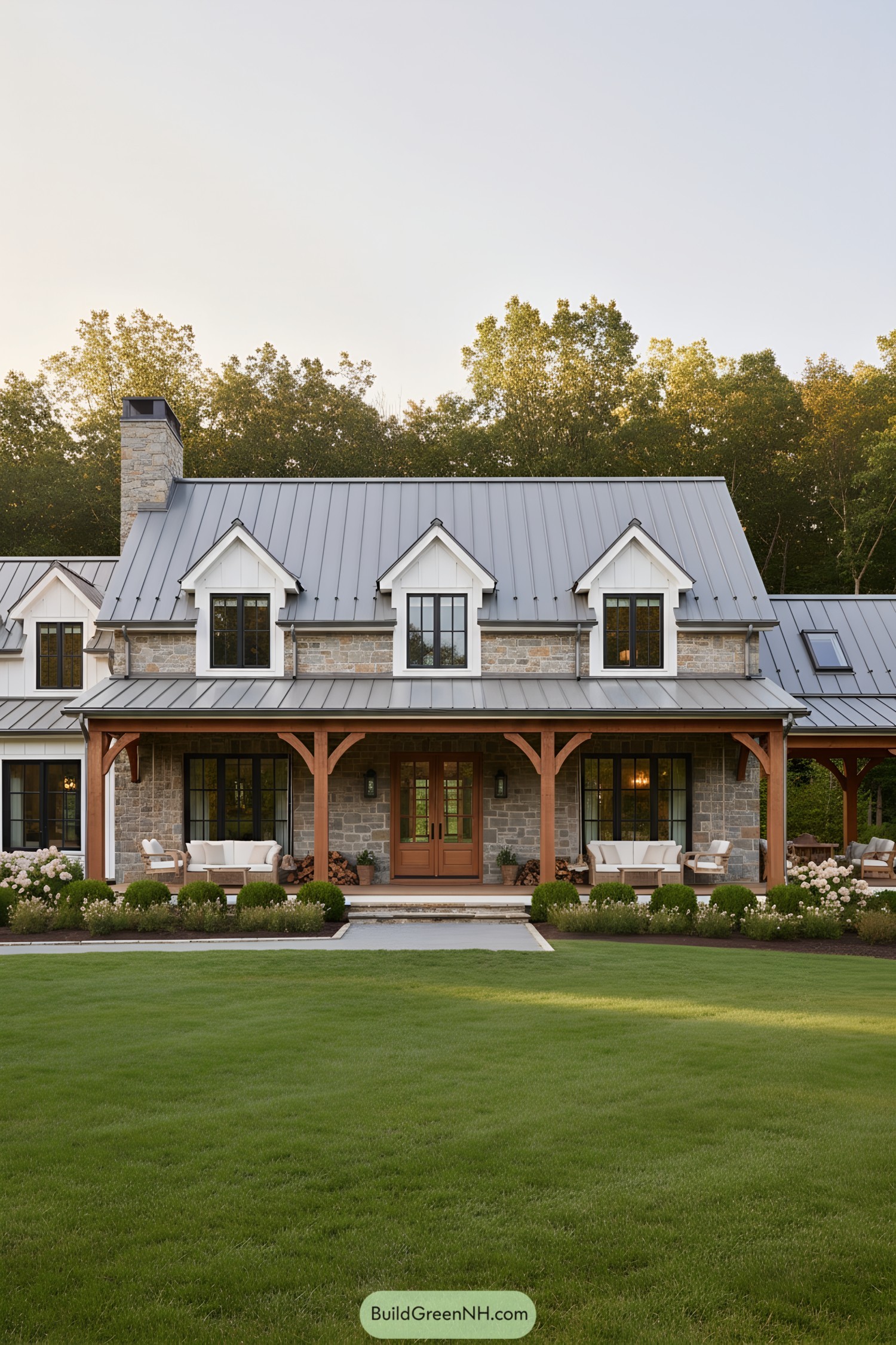 Country home with stone facade and metal roof