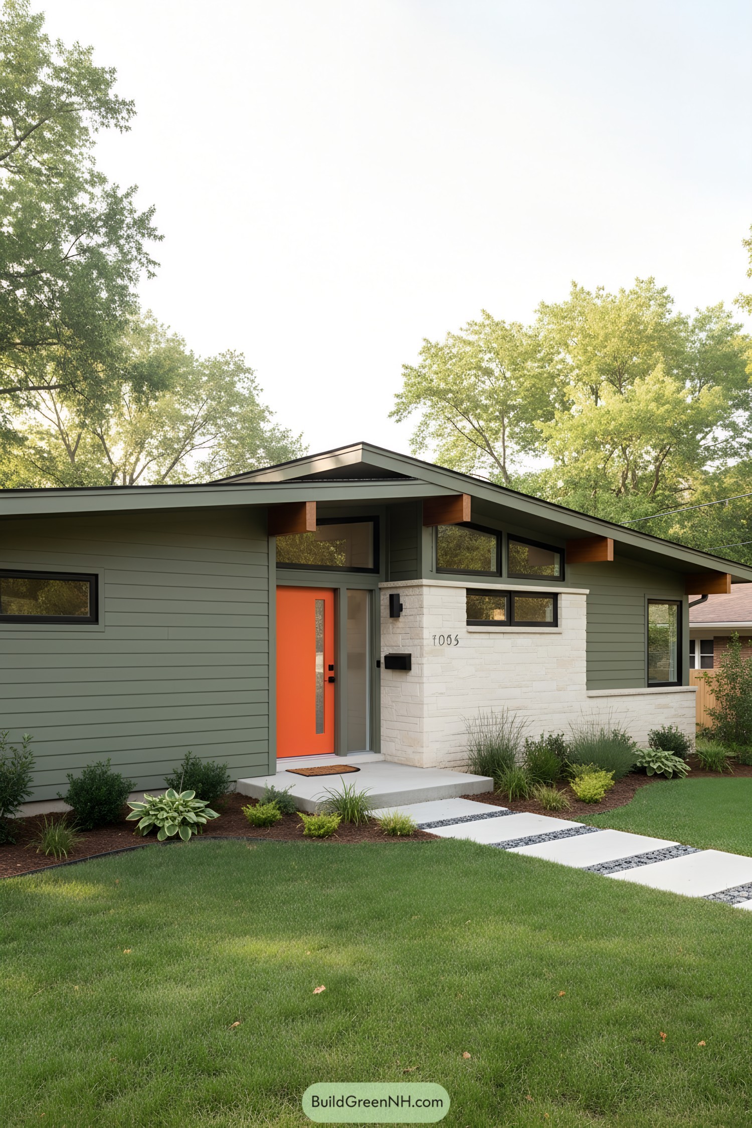 Green ranch with clerestory windows and orange door