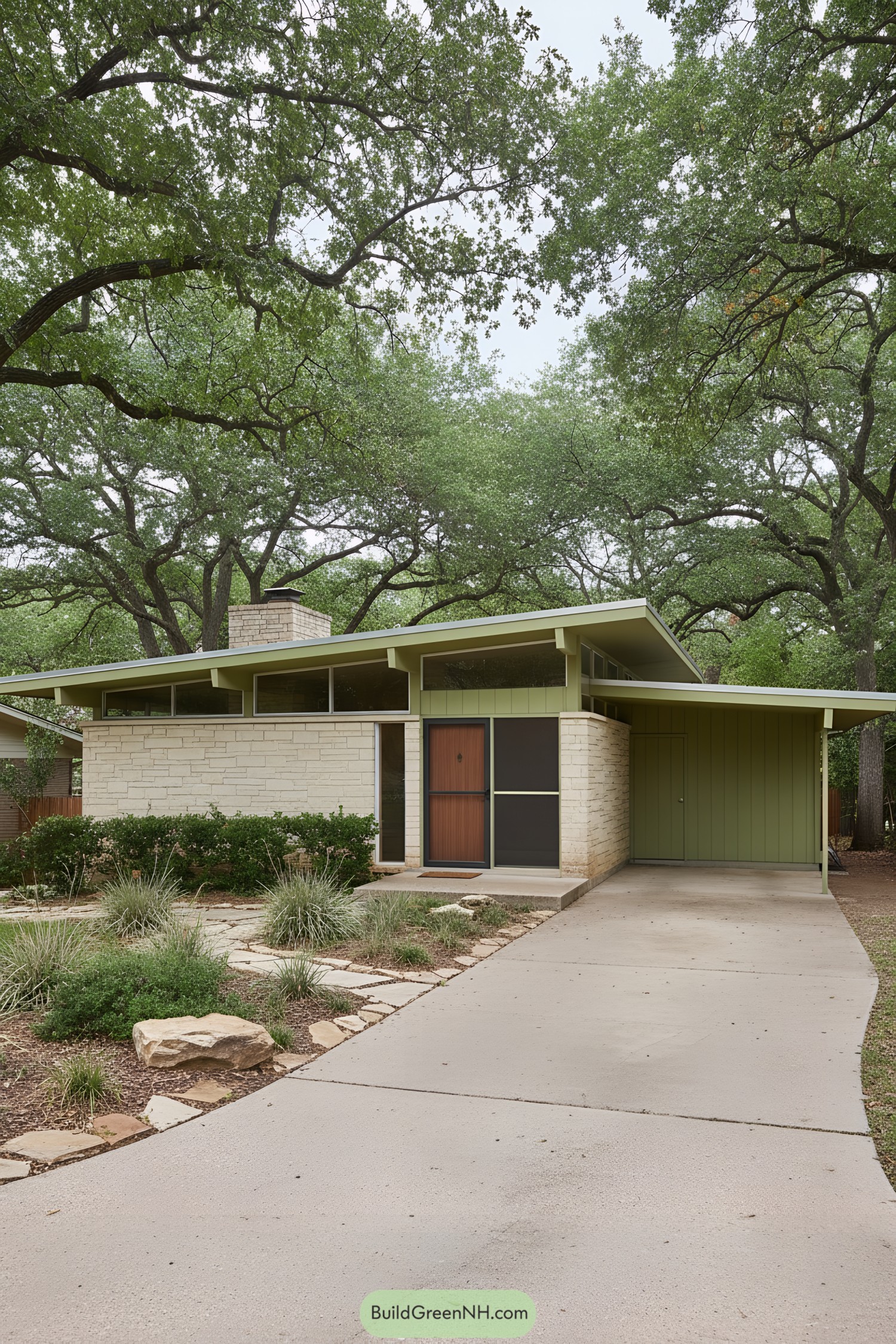 Green midcentury ranch with stone facade and carport under mature oaks
