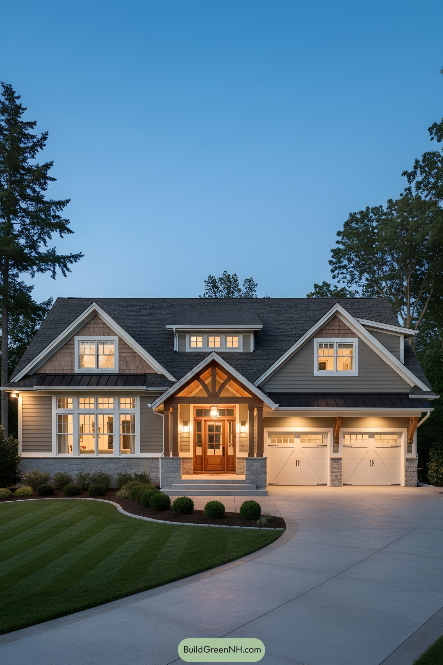 Evening view of a craftsman ranch with timber entry and double garage