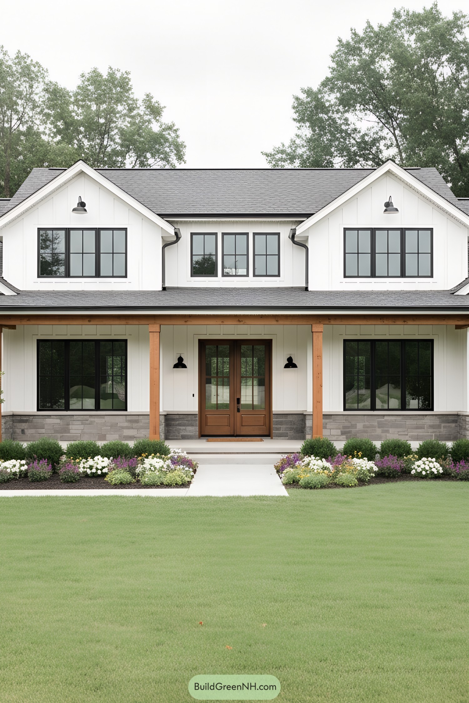 Modern white board-and-batten ranch with black windows, timber posts, and stone base