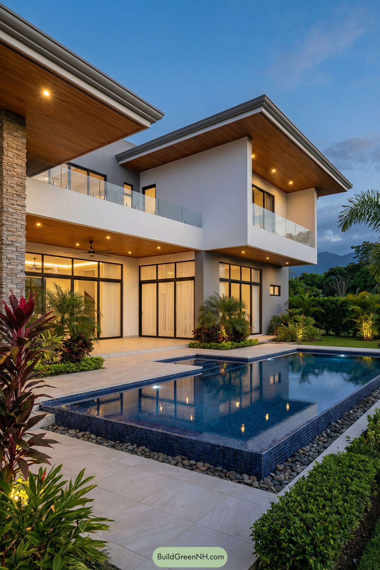 Modern villa with tiered blue pool and cantilevered roofs at dusk