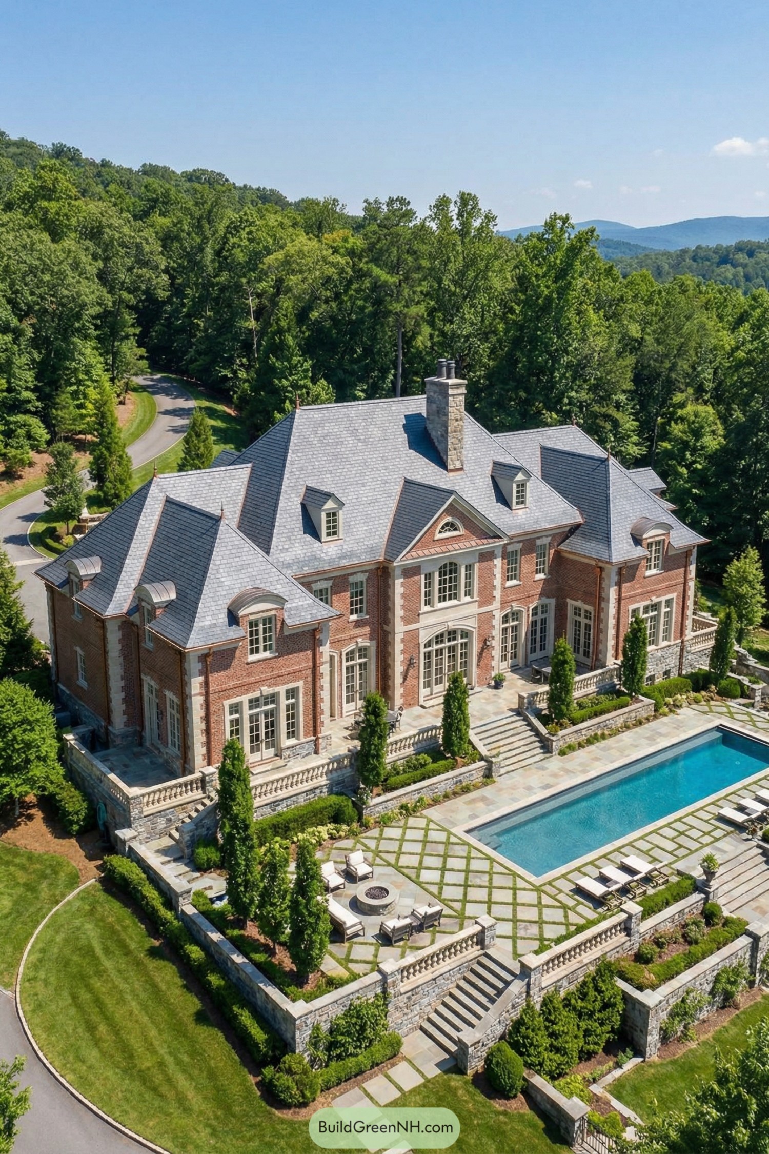 Brick estate with slate roof and pool terrace