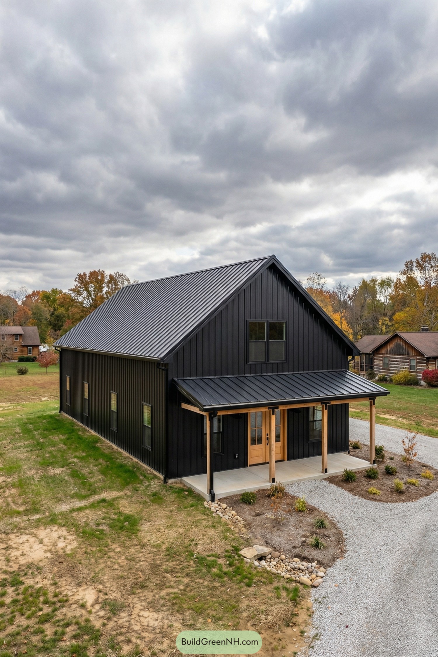 Black metal barndo with gable roof and timber porch posts