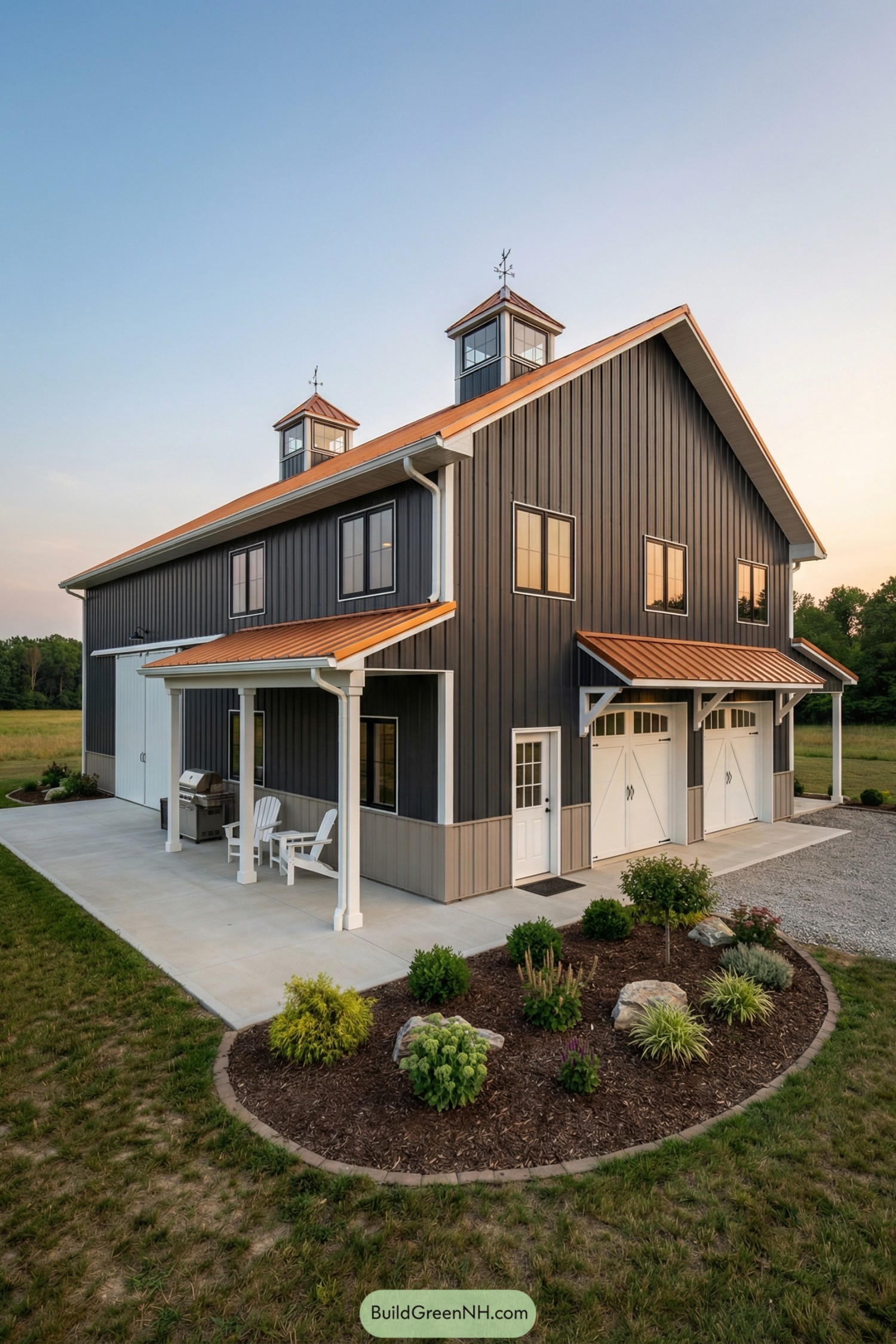 Dark metal barndo with copper roof and twin cupolas