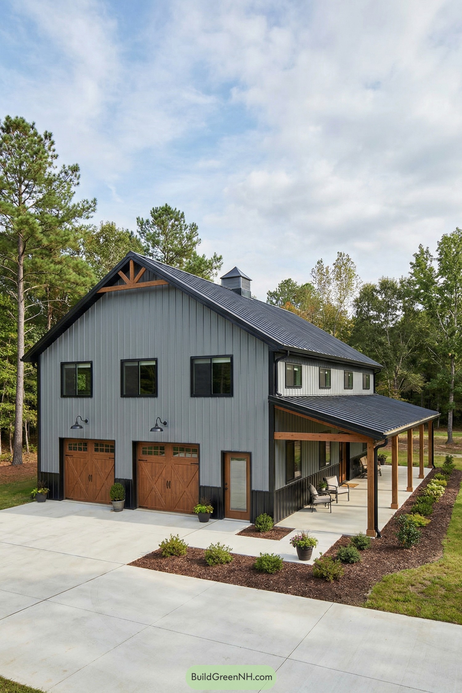 Gray metal barndo with wraparound porch and wood doors