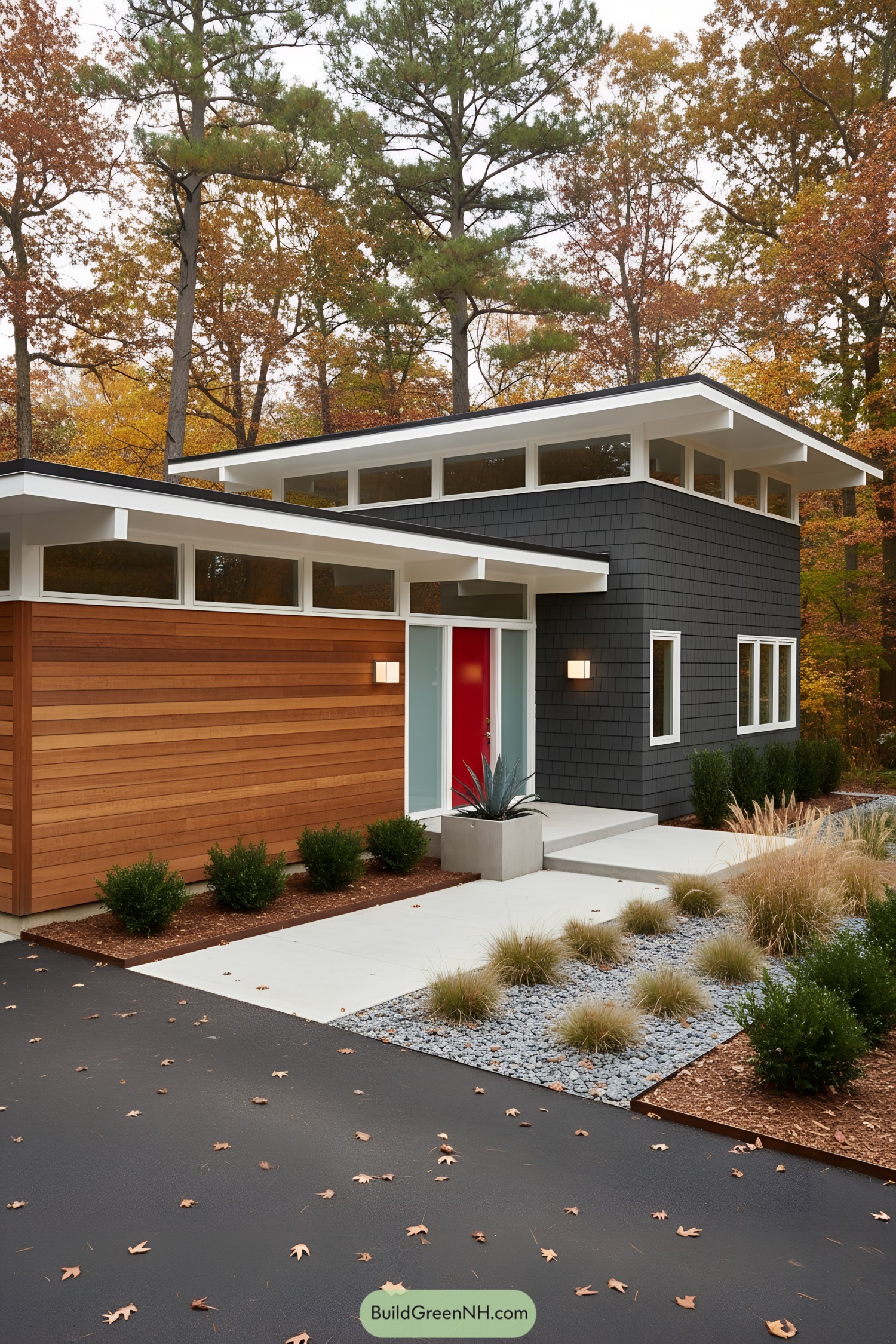 Midcentury home with cedar siding, dark shingles, clerestory bands, and a red door