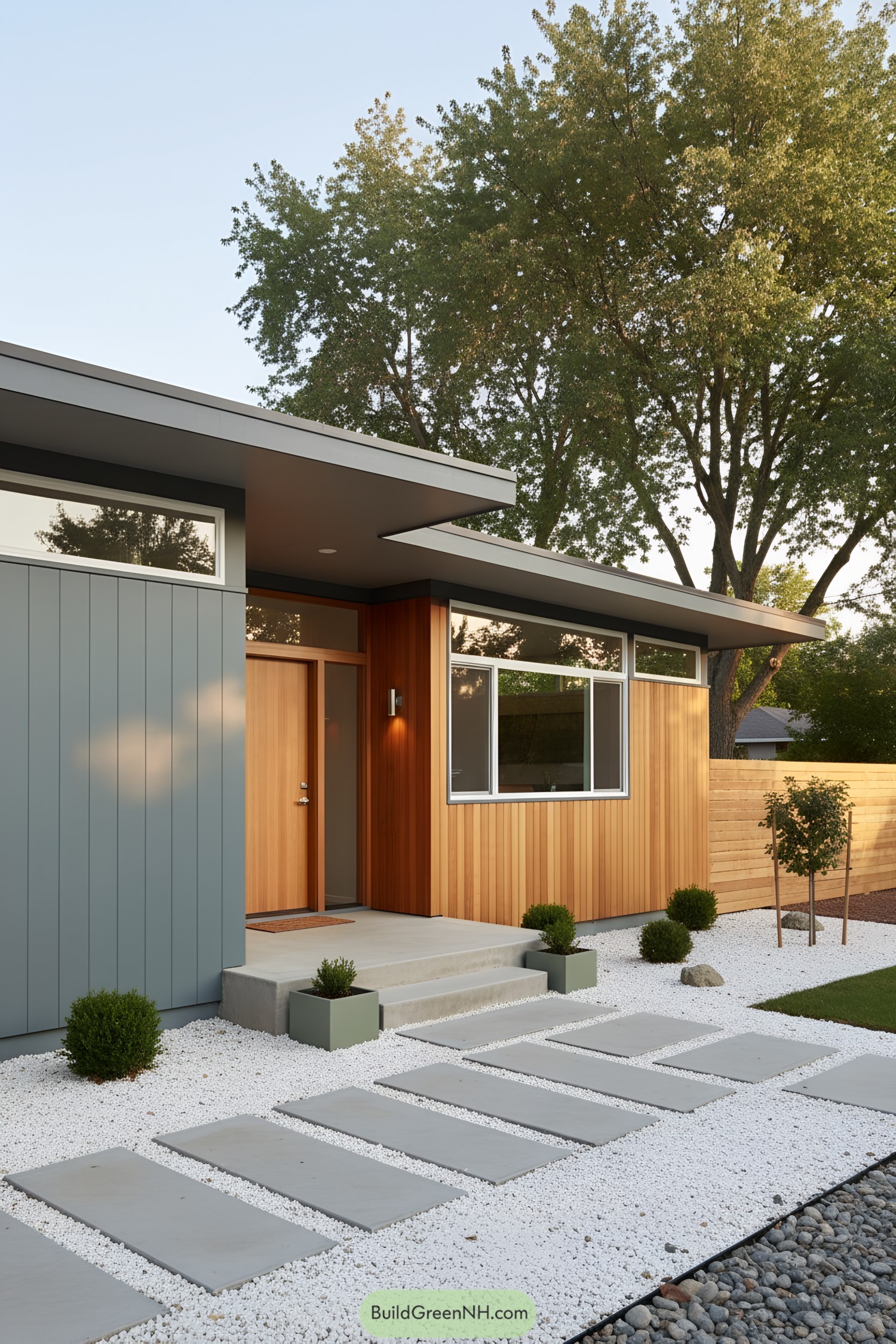 Mid-century home with cedar and gray siding, low-slung roof, and stepping-stone path