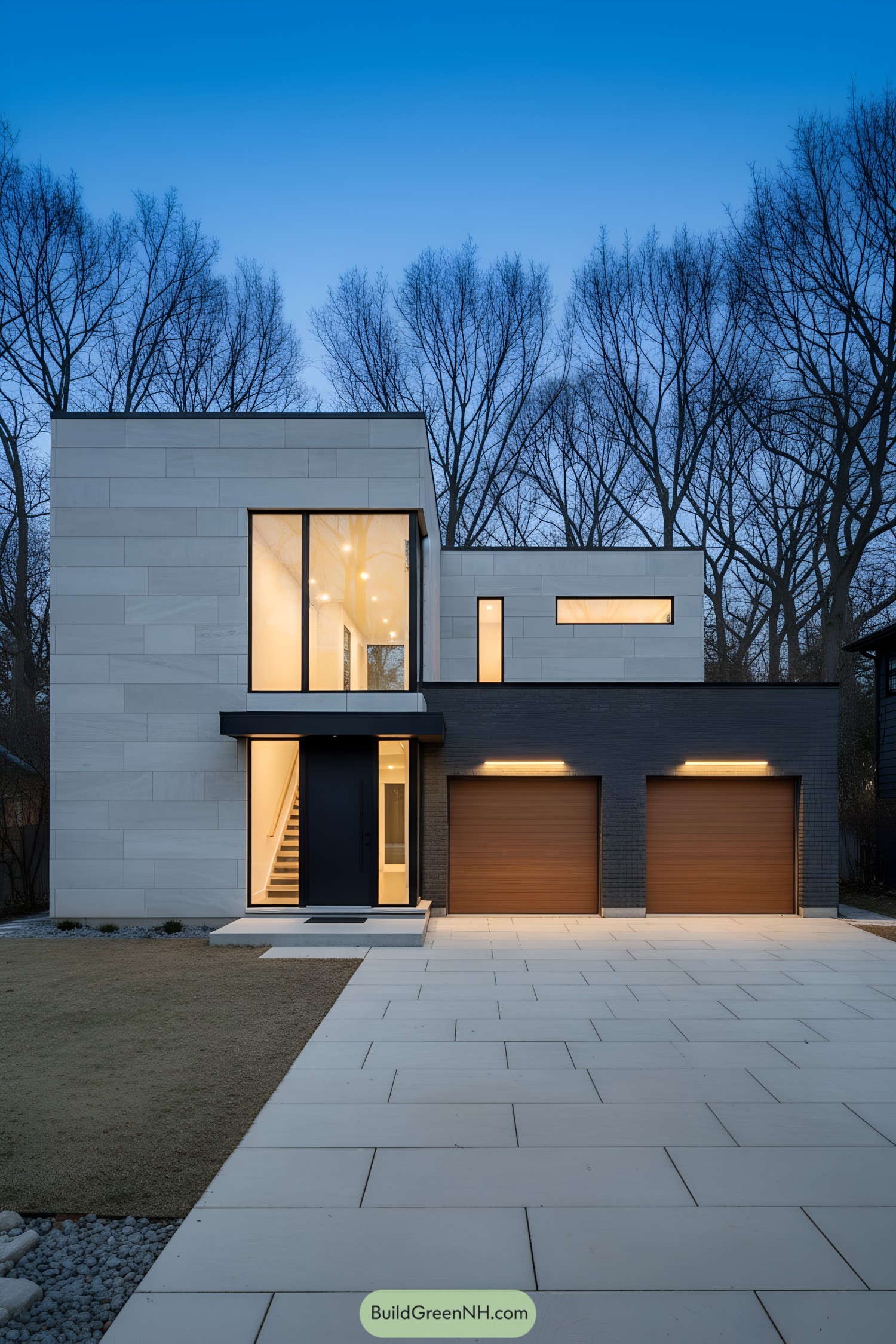 Modern flat-roof home with tall window and twin wood garage doors