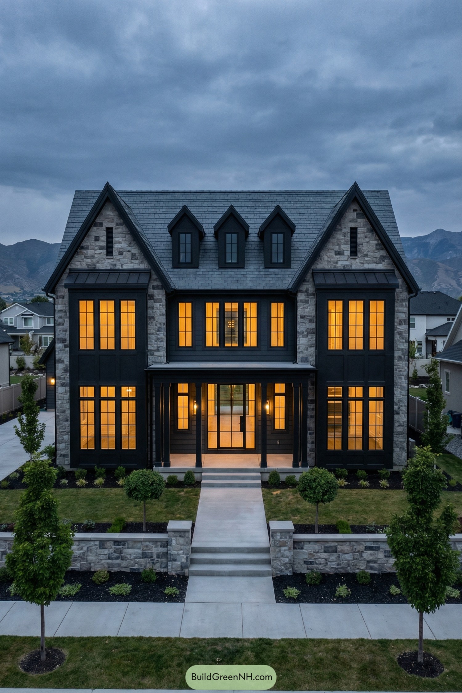 Black gabled mansion with warm-lit windows