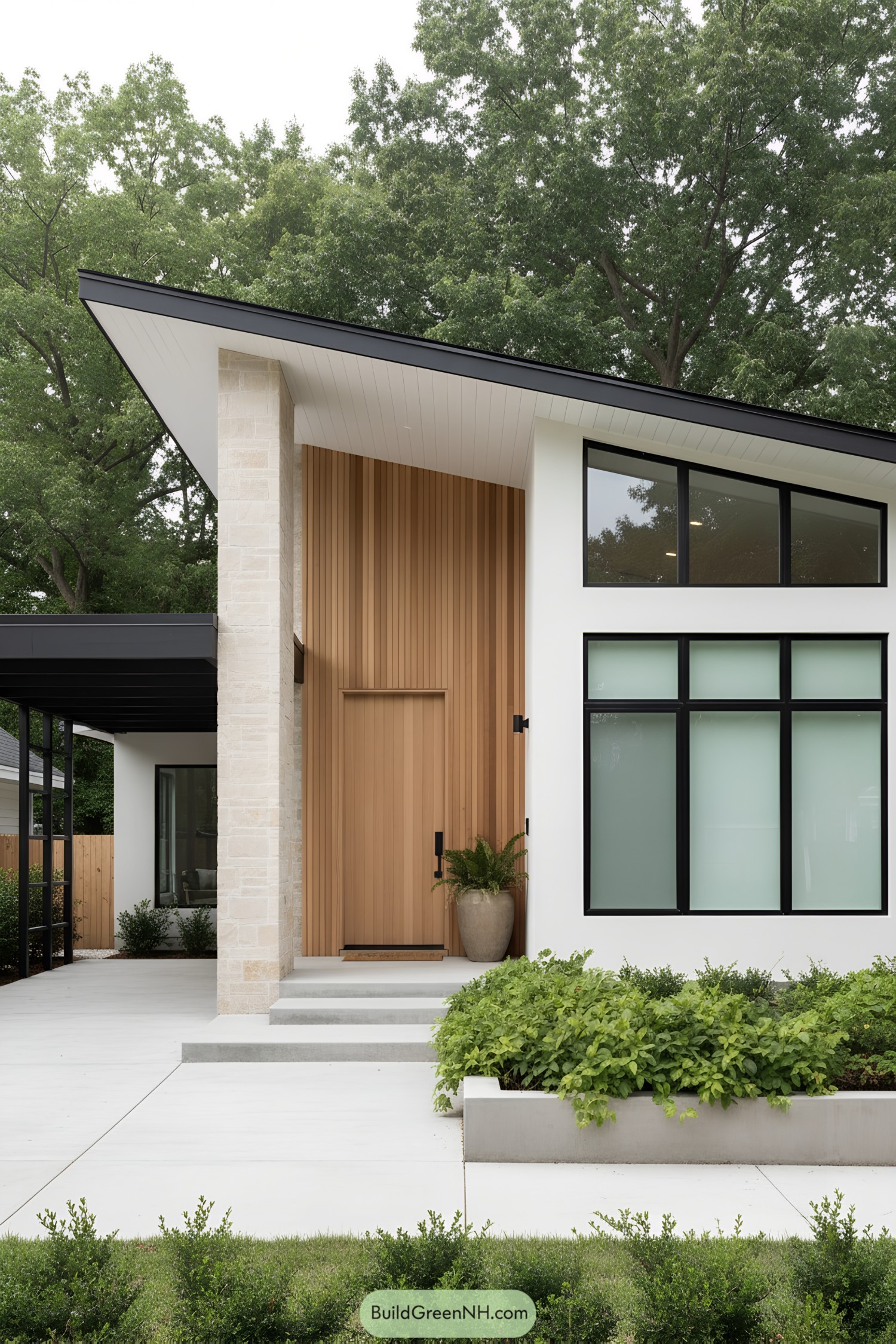 Minimalist bungalow with sloped roof, cedar entry, and black-trimmed windows