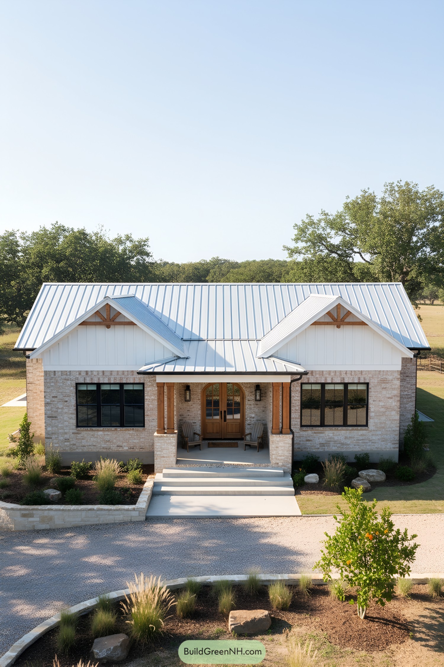 Modern ranch with metal roof and brick facade