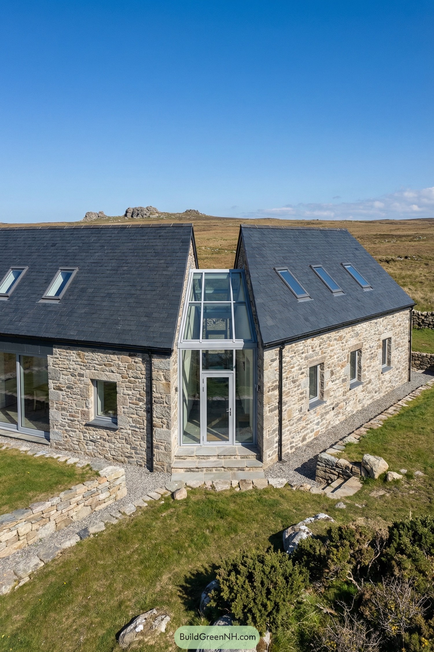Modern stone cottage with glass atrium entry