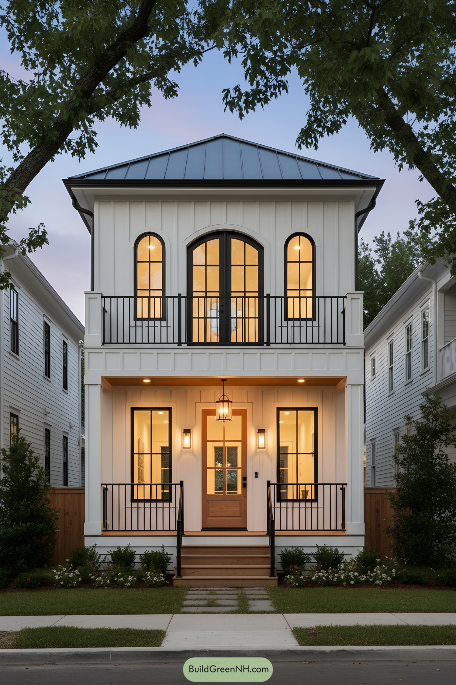Two-story compact house with arched windows and metal roof