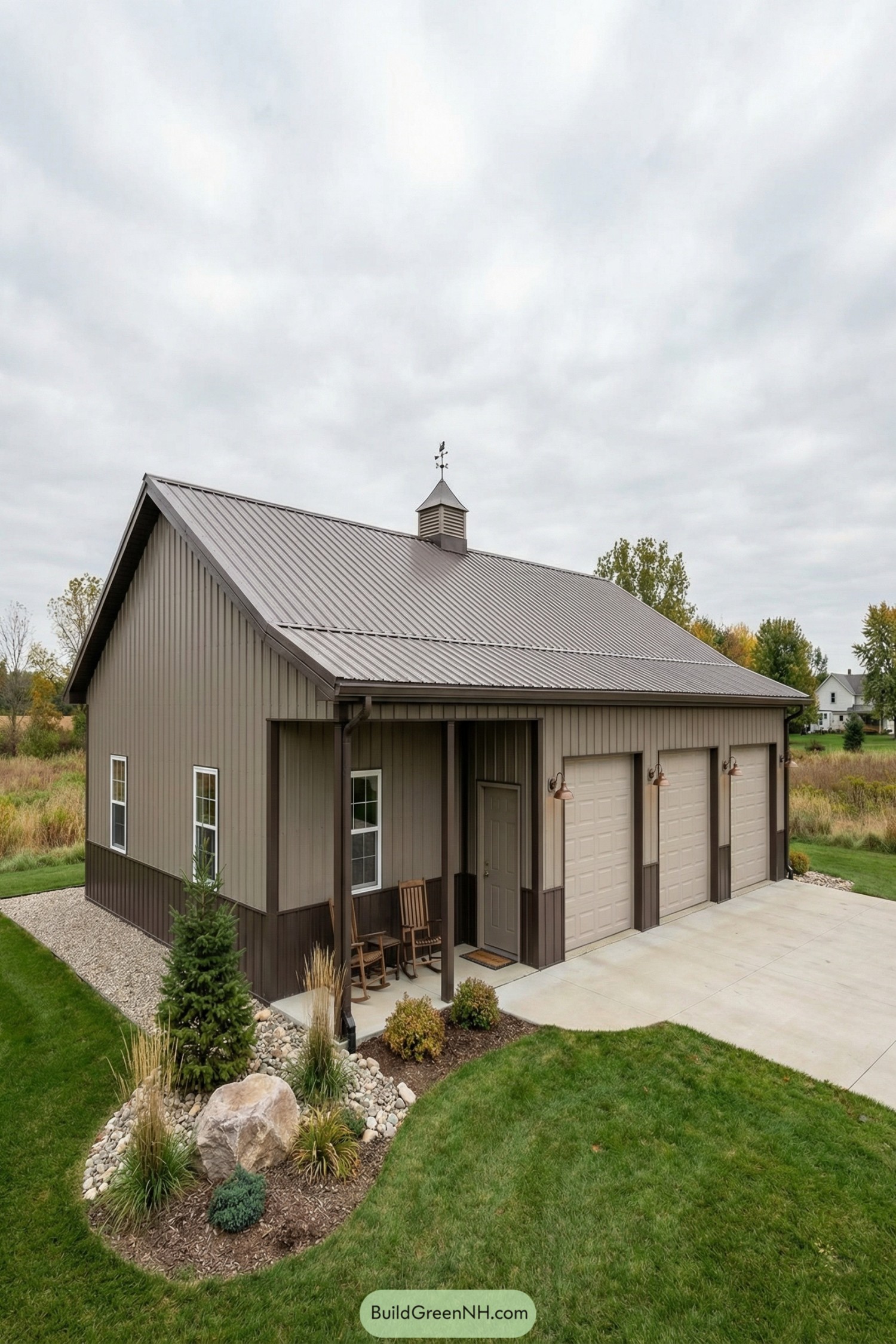 Pole barn house with three garage doors and small porch