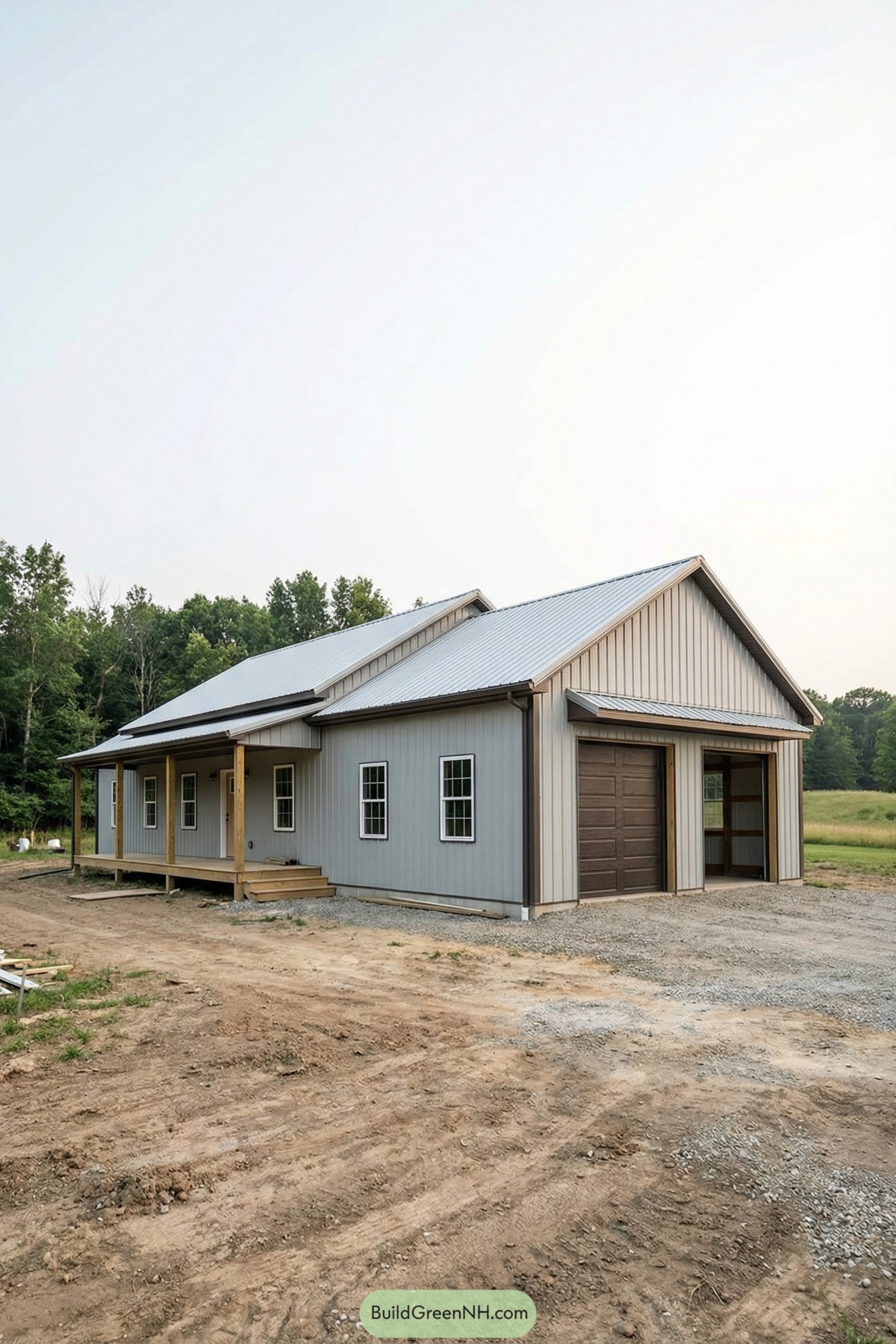 Gray pole barn house with metal roof and attached garage