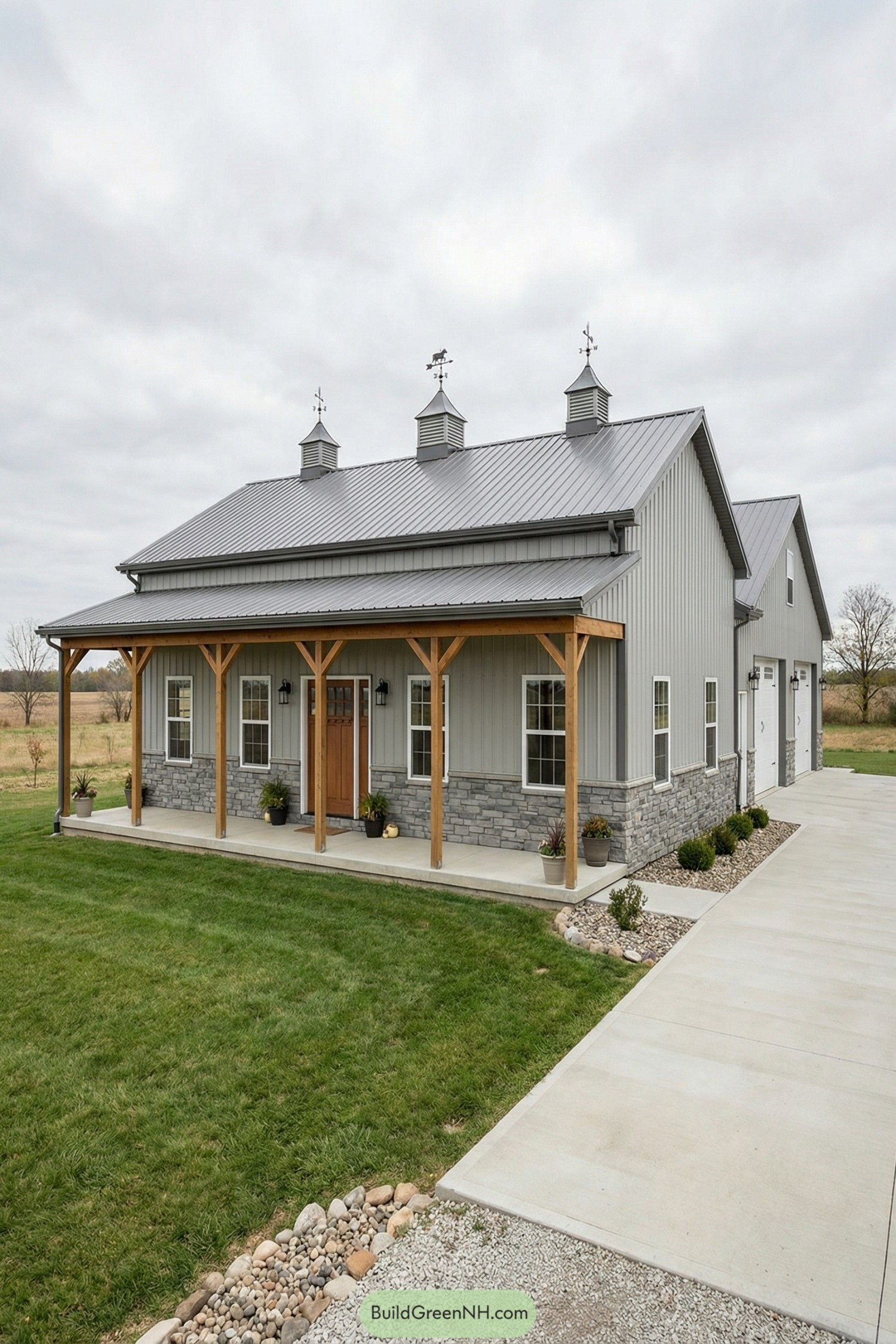 Gray pole barn home with stone wainscoting, wood porch posts, and attached three-car garage