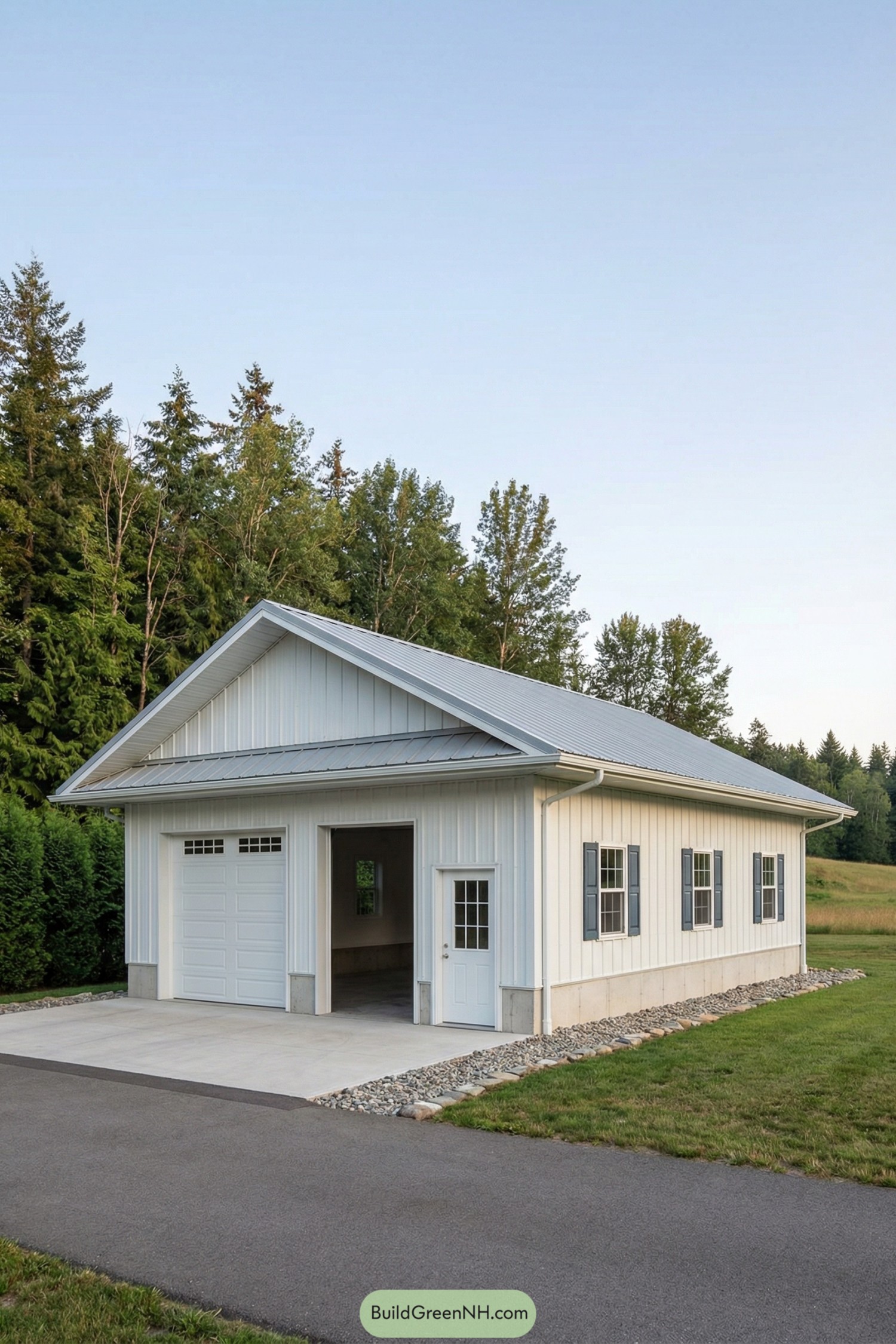 White gable pole barn with single garage and side windows