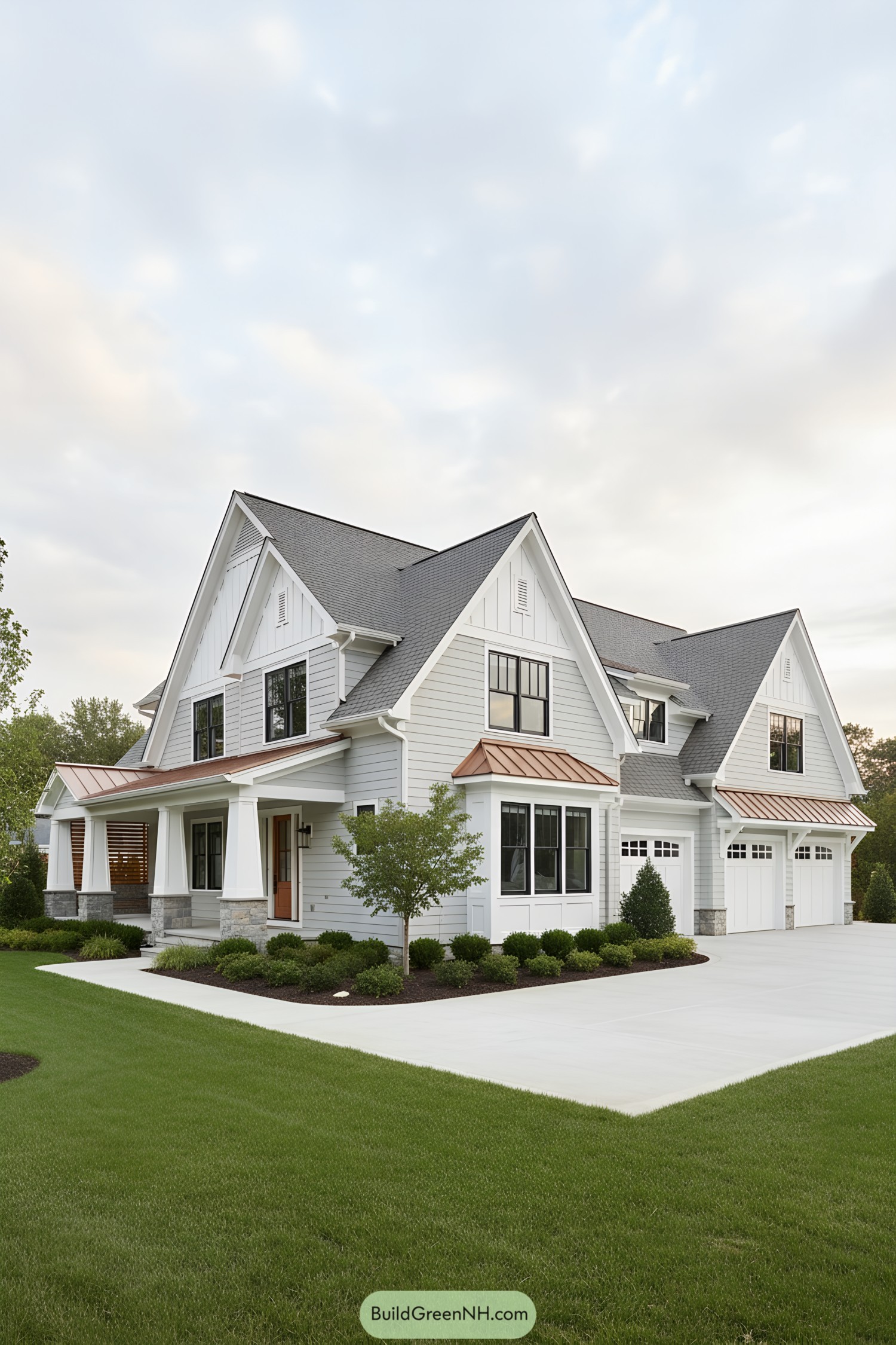 White farmhouse with copper awnings and gables