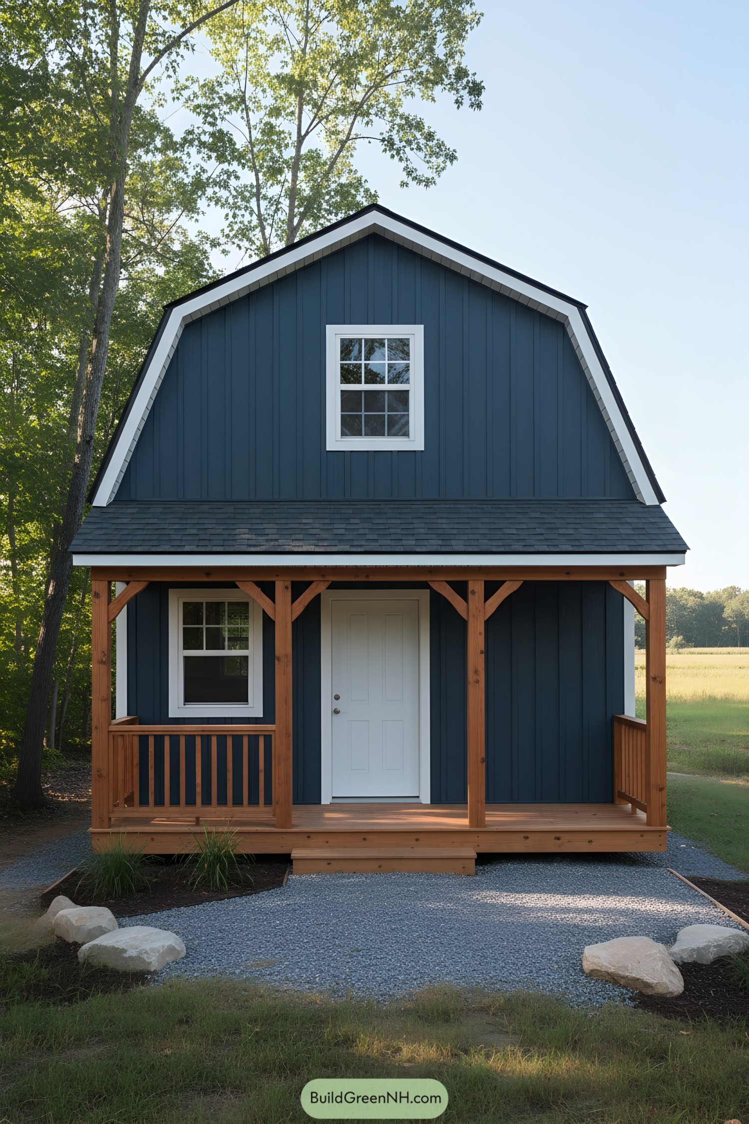 Blue gambrel shed with loft and wood porch
