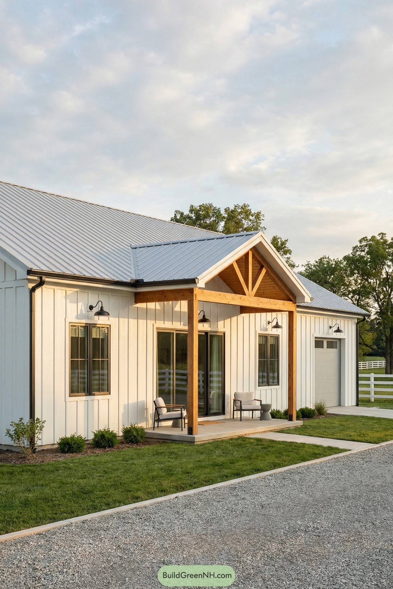 Small white barndo with timber porch and metal roof