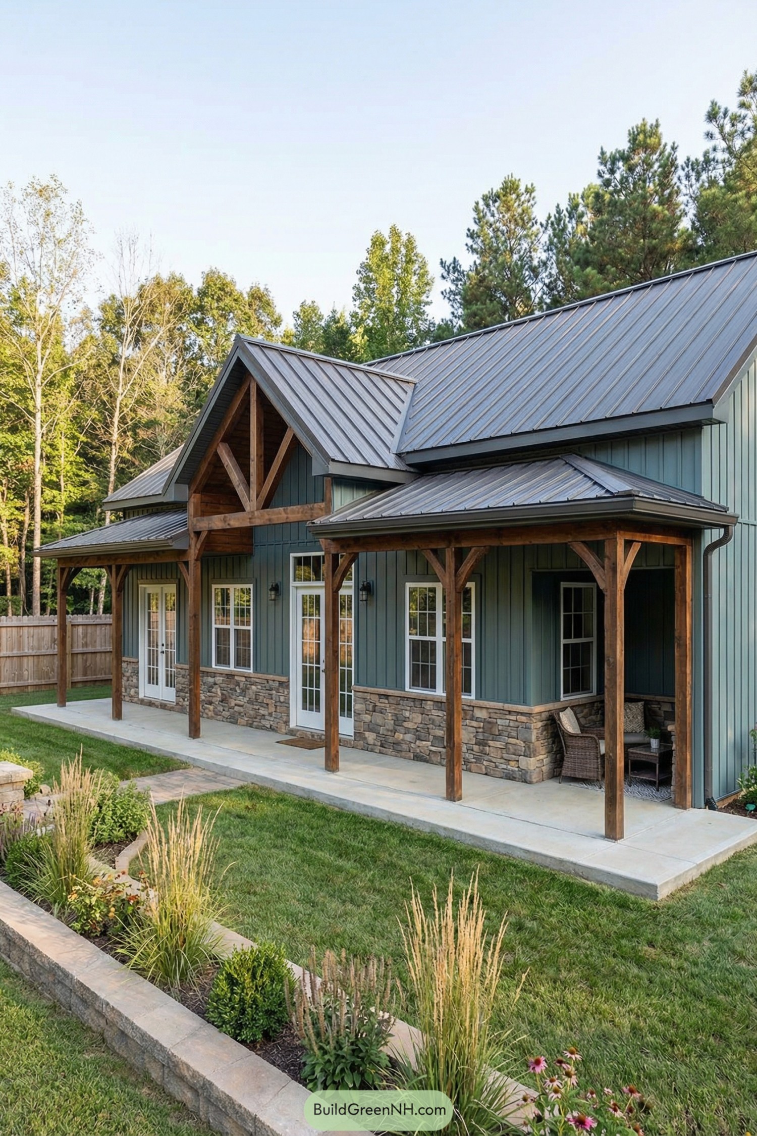 Blue metal-roof barndo with stone base and timber posts