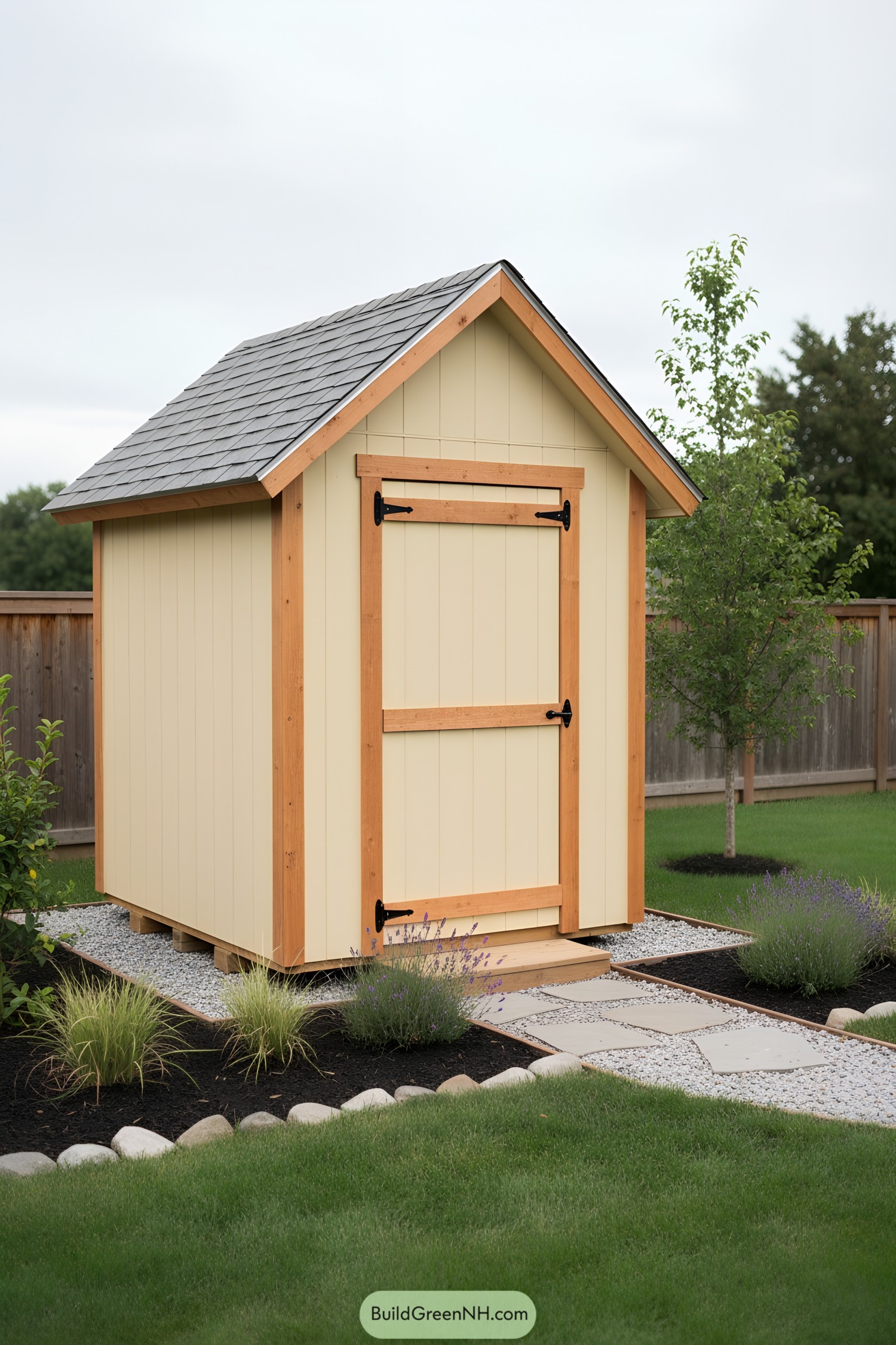Small cream shed with wood trim and shingle roof