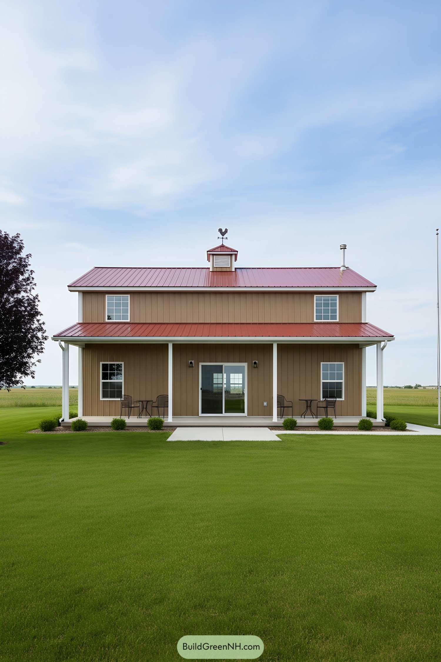 Steel farmhouse with red metal roof and wraparound porch