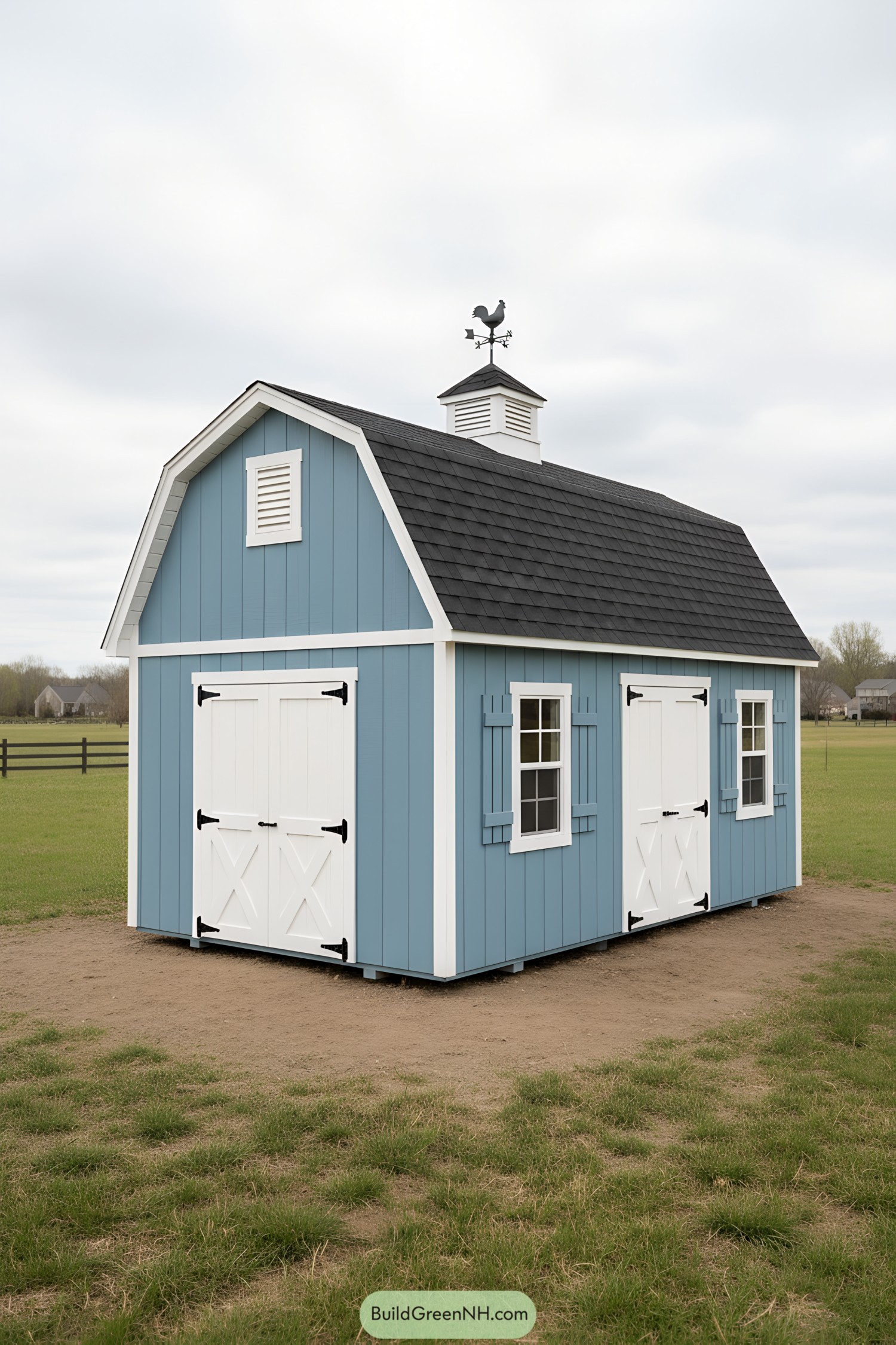 Blue mini barn with white trim and cupola