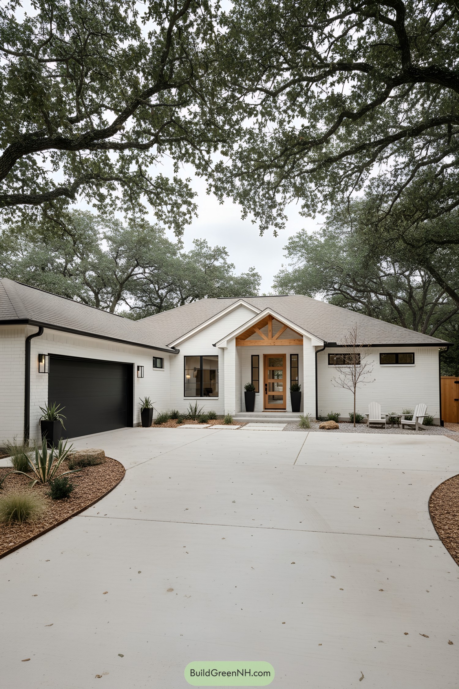 White brick ranch with timber gabled porch and black garage door beneath spreading oaks