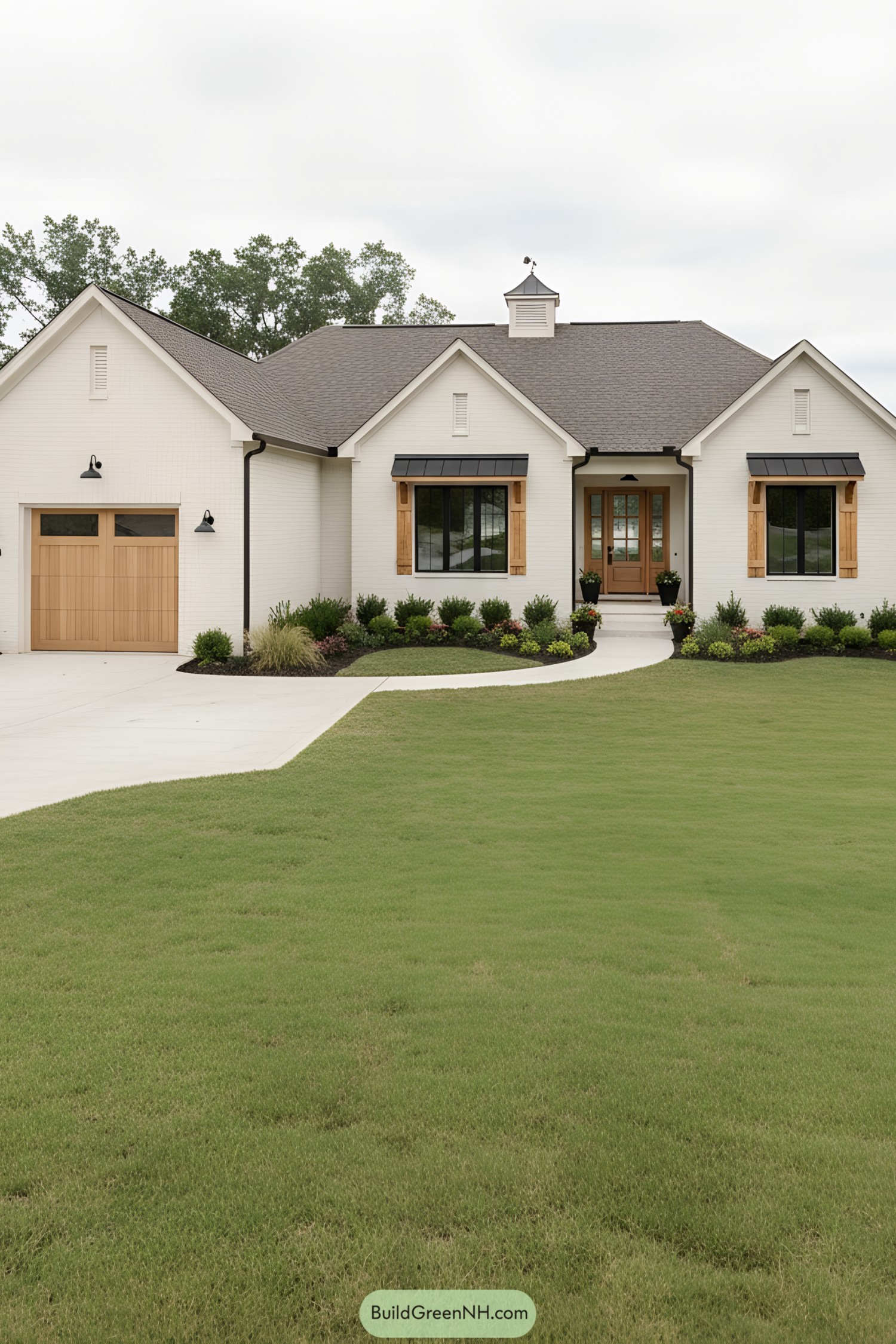 White brick ranch with cedar accents, black metal awnings, and tidy landscaping