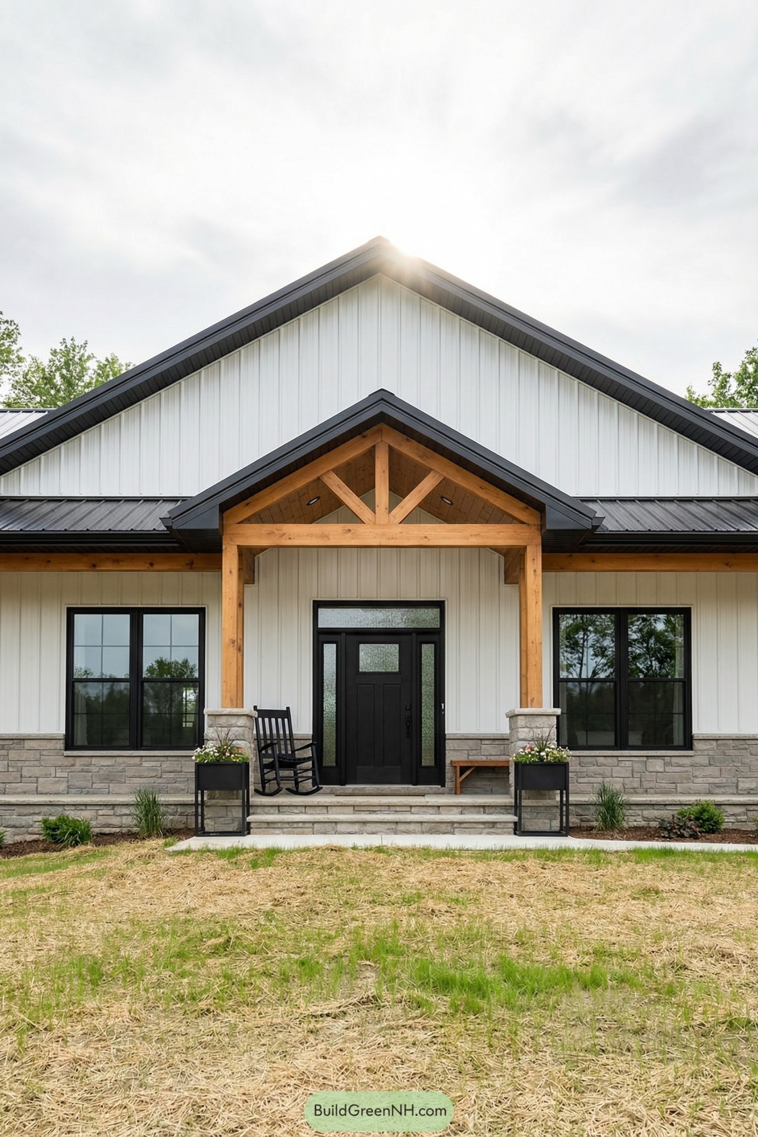 White board-and-batten barnhouse with cedar porch gable and black trim