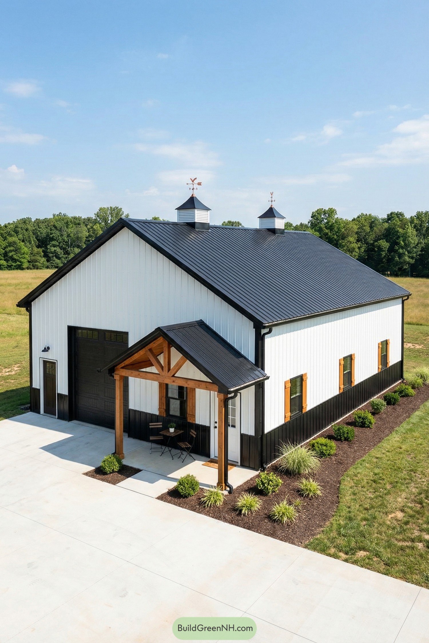 White pole barn with black roof and wood accents