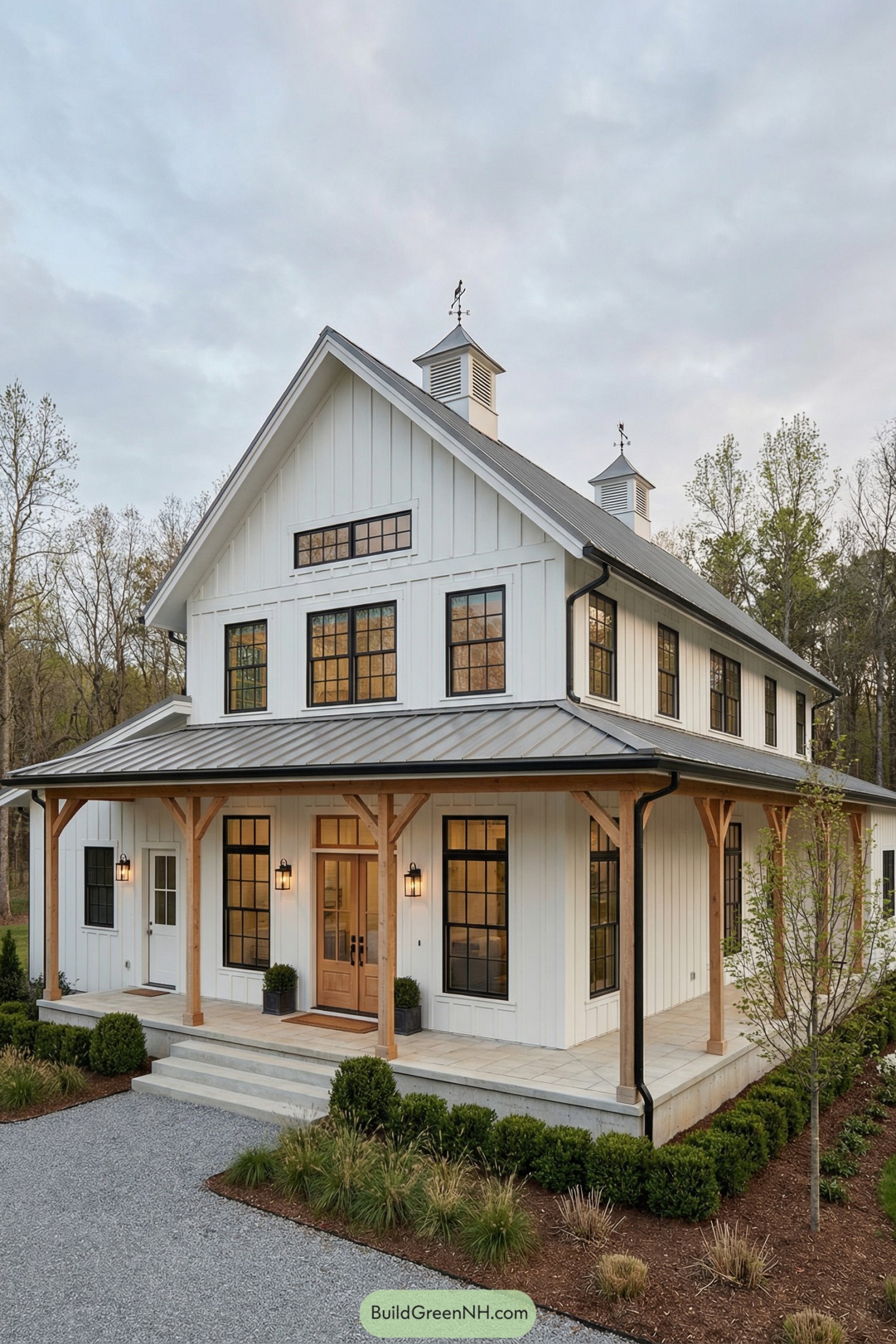White board and batten barn home with wraparound porch