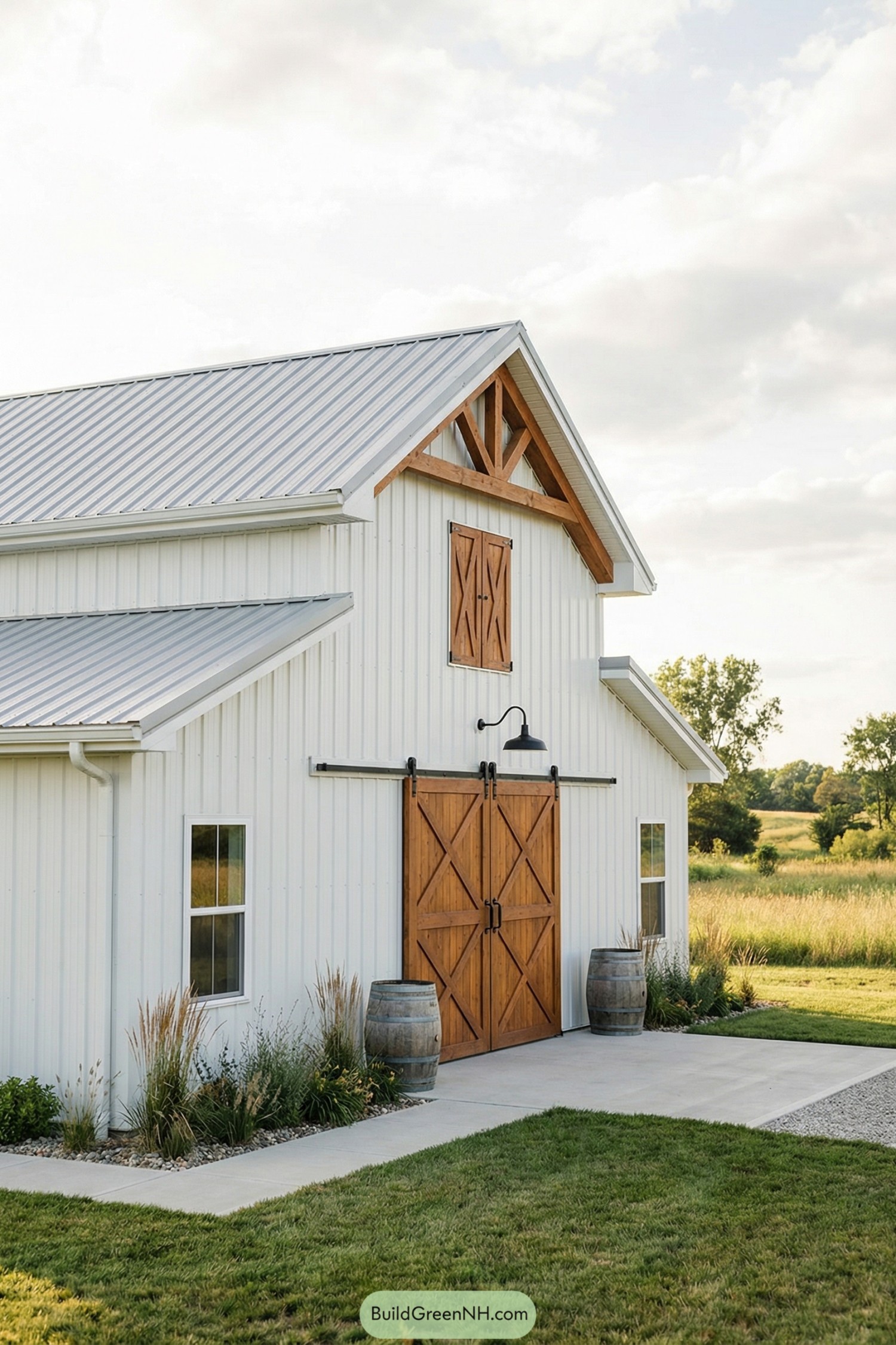 White pole barn with cedar doors and truss detail